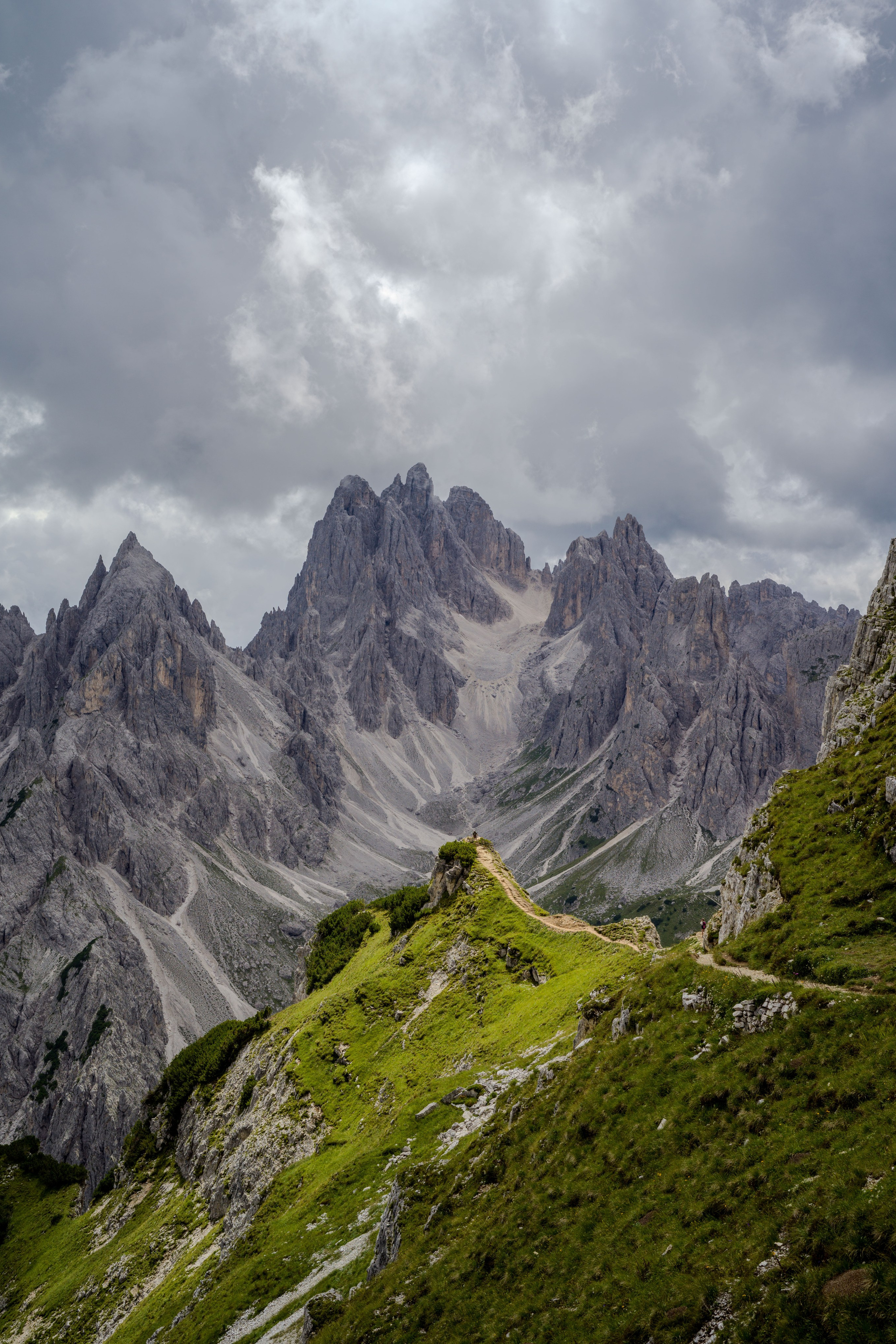 Romantic marriage proposal in the Dolomites with breathtaking mountain and alpine meadow views.