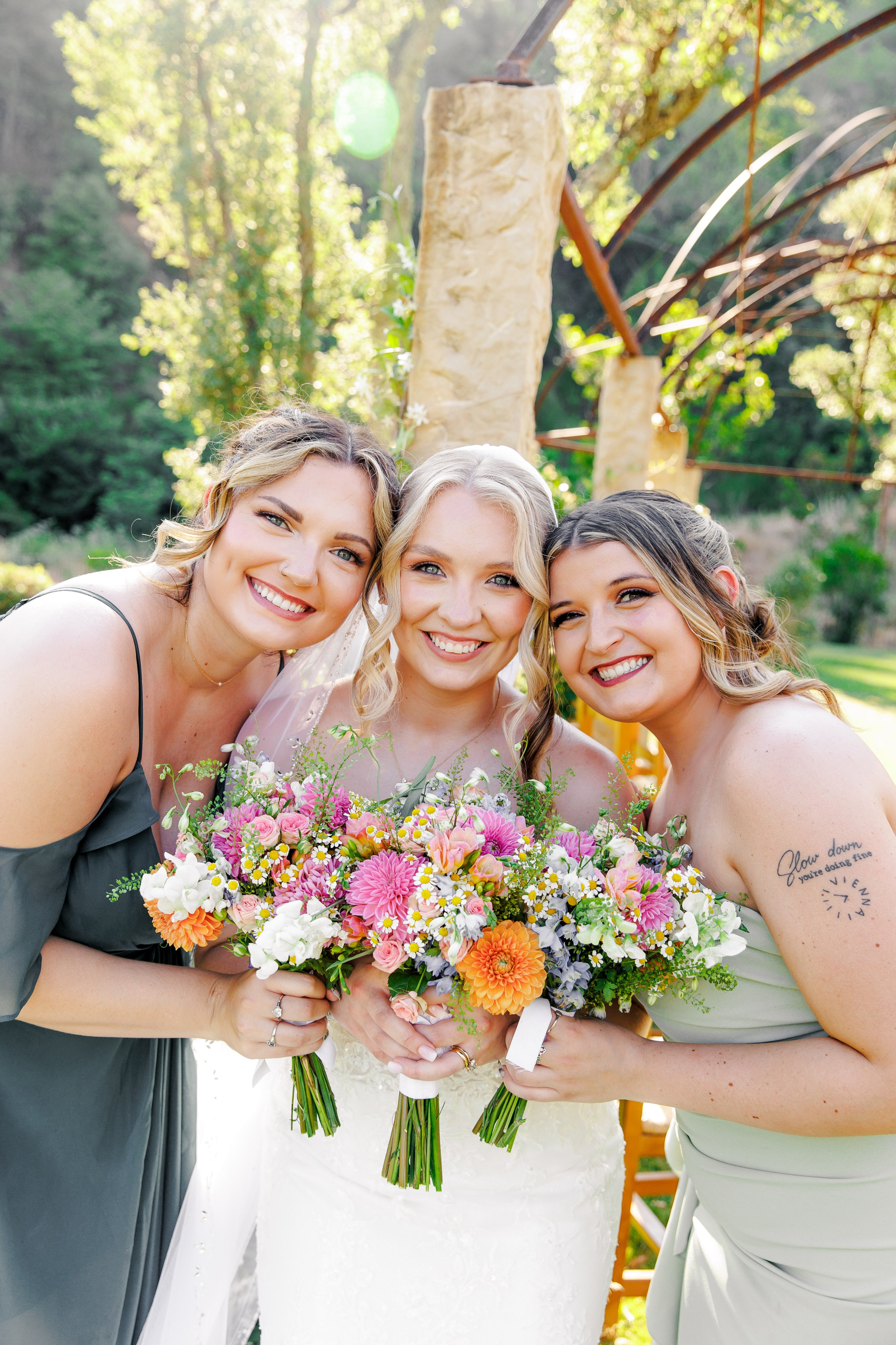 Bride laughing with bridesmaids before the ceremony starts