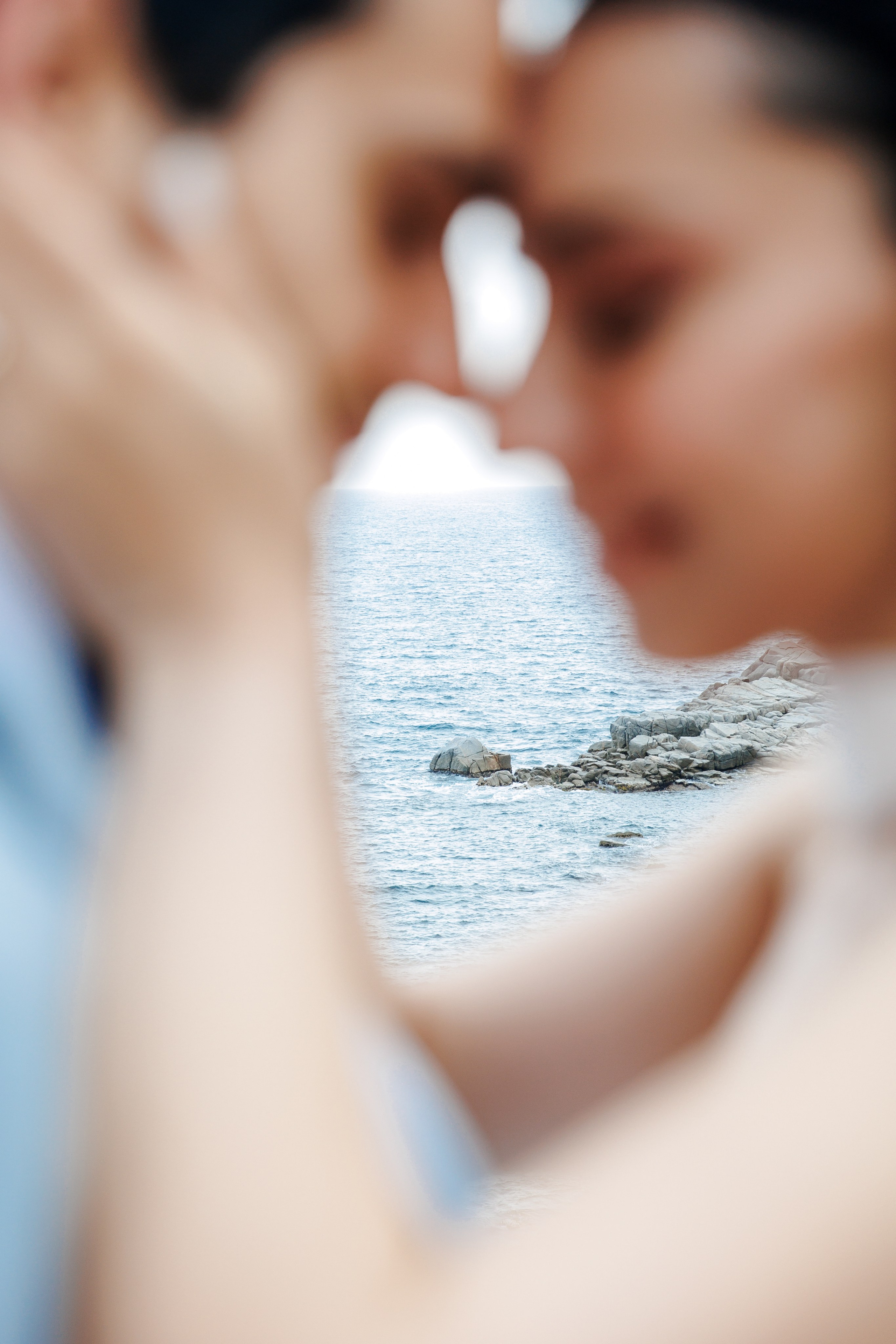 Intimate moment: bride and groom sharing a moment of happiness next to the Mediterranean Sea