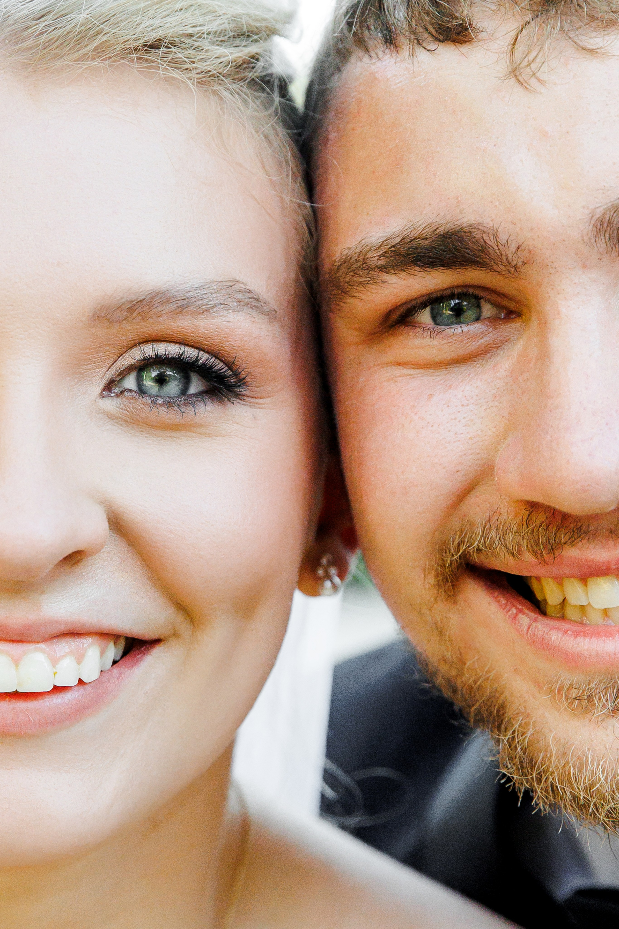Close-up portrait of happy groom and bride