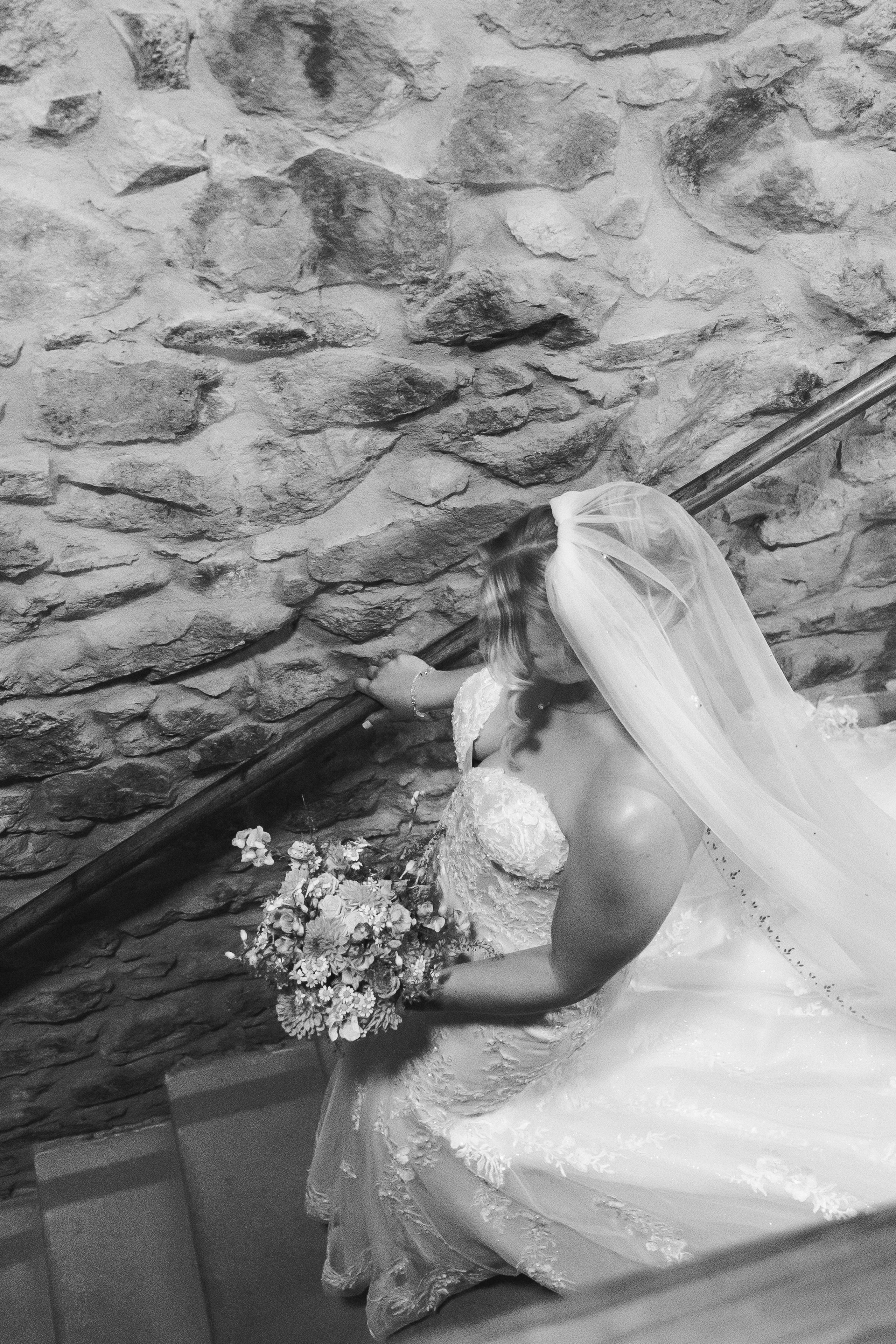 Bride is going down the stairs to meet the groom