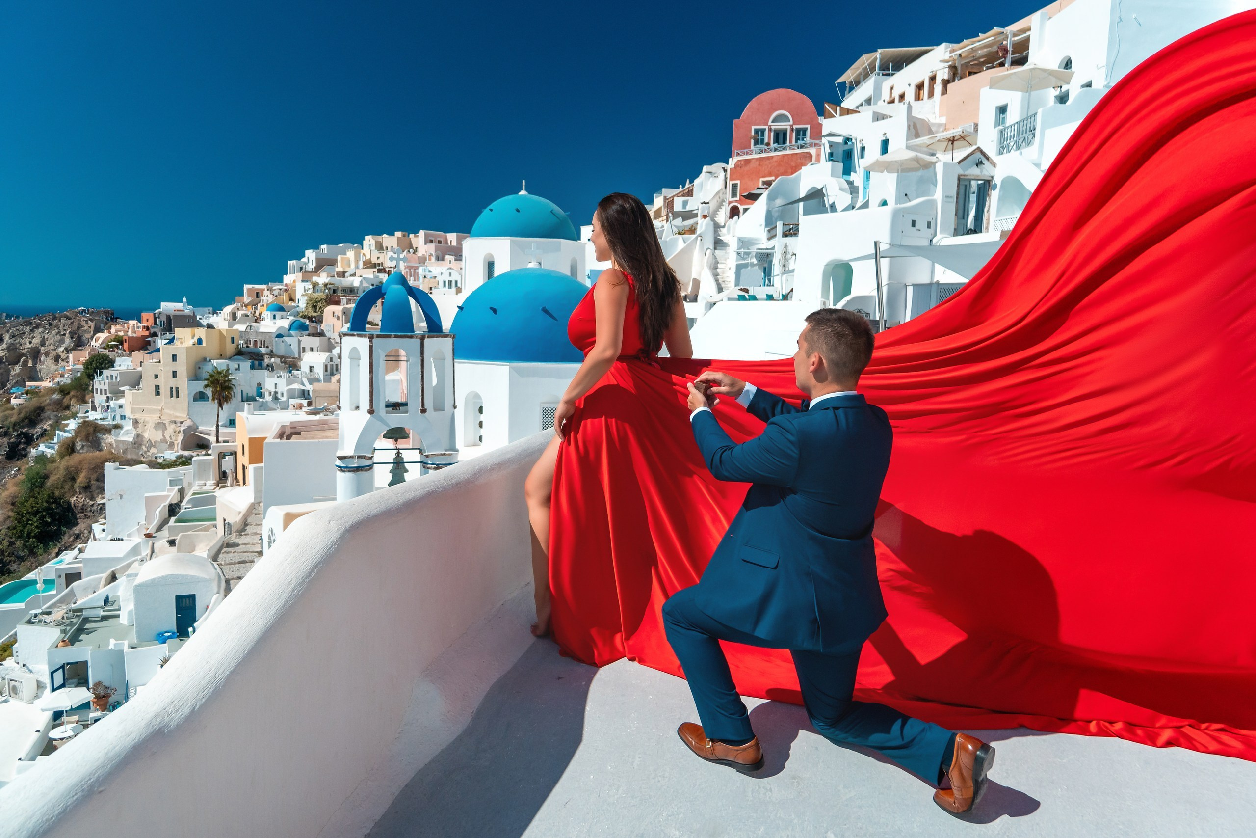 Ethereal Proposals: Santorini Flying Dress Photography
