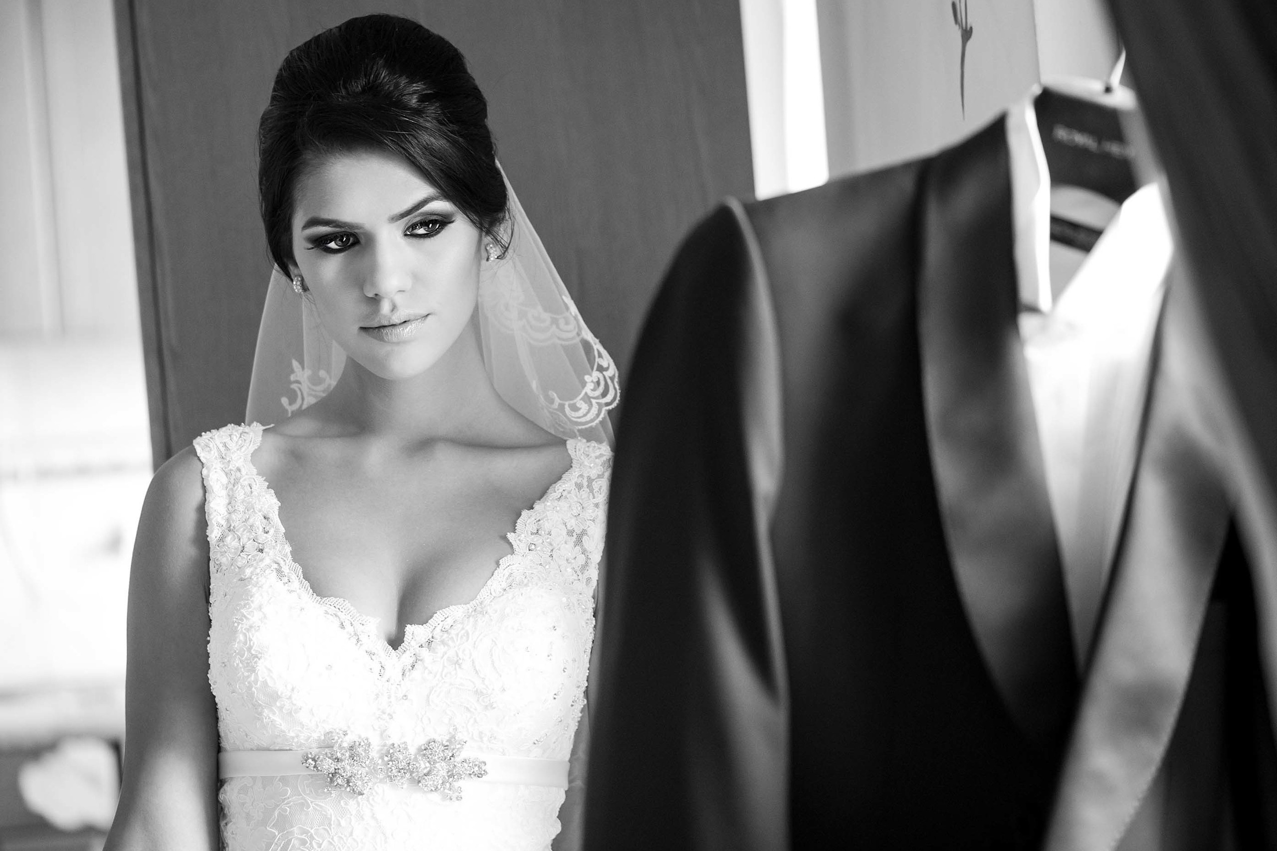 Wedding photographer Bucharest Romania bride looking at the groom's suite Nikon D850