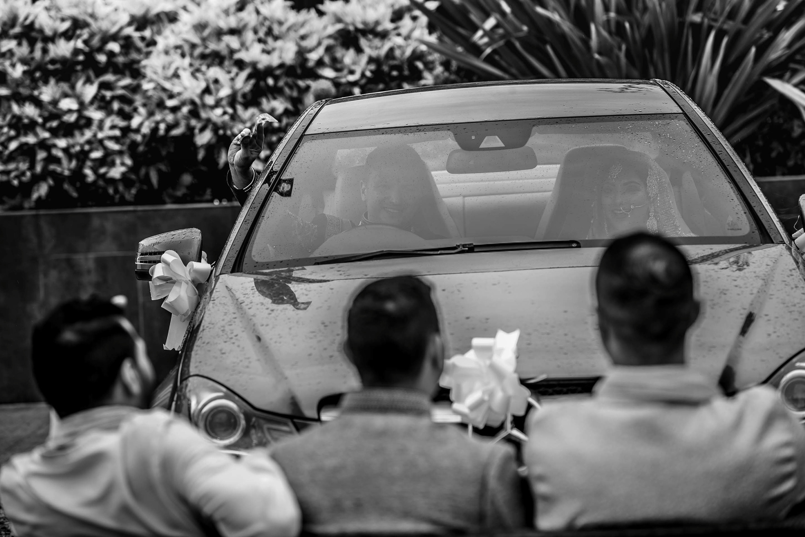Wedding photographer Ladywood Estate: Country House Wedding Venue Leciester UK Nikon D850 Bride and groom's car stopped by three groomsmen who get paid by the groom
