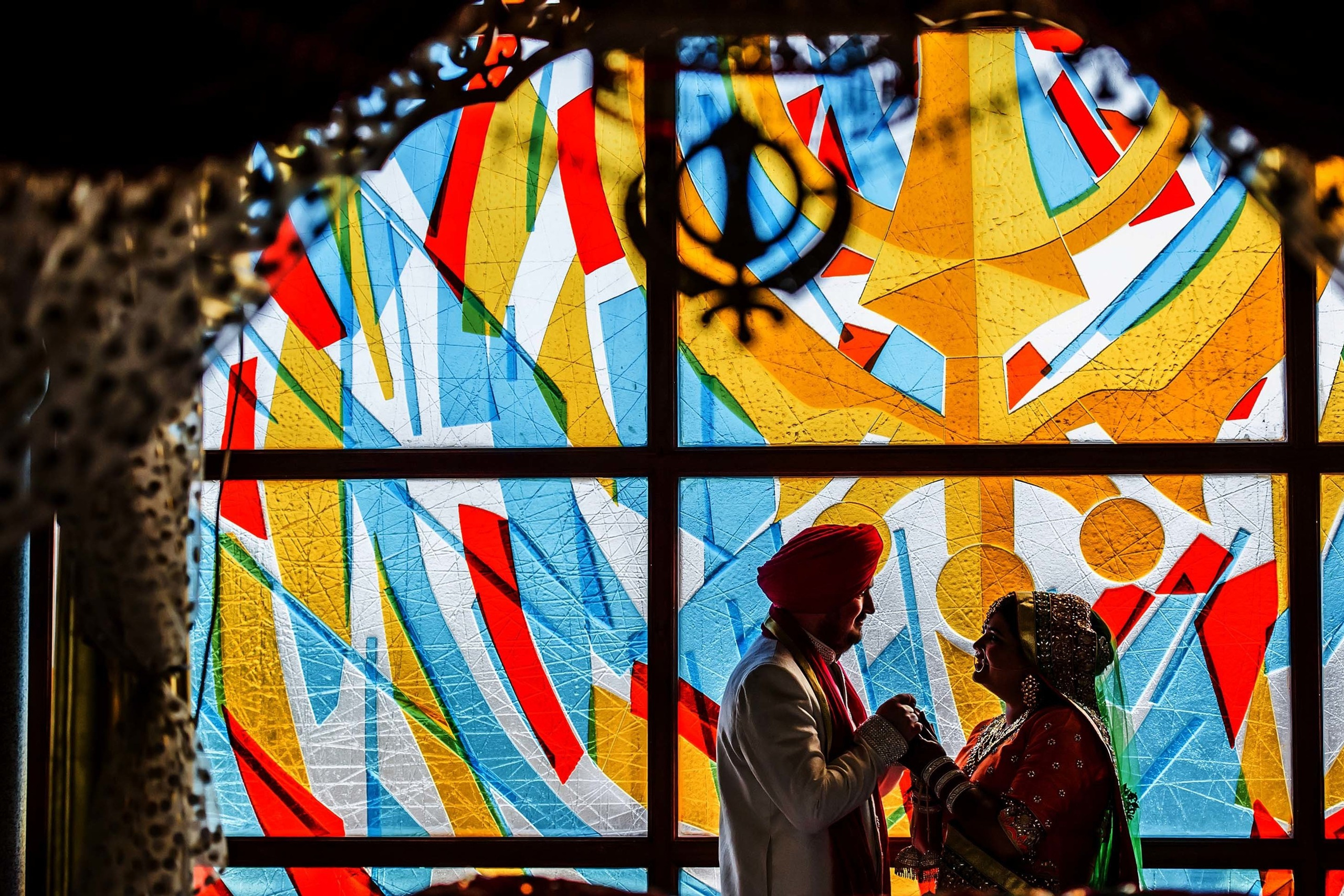 Wedding photographer Guru Nanak Darbar Gurdwara London UK Nikon D850 couple holding hands after religious ceremony