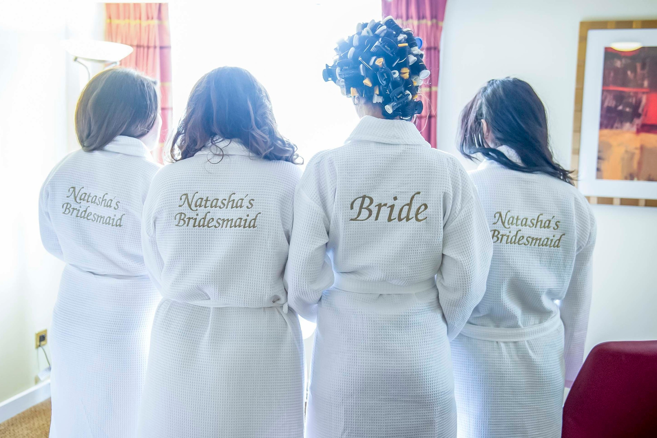 Wedding photographer Hilton Watford, Bride and bridesmaids in bath robes London UK Nikon D850