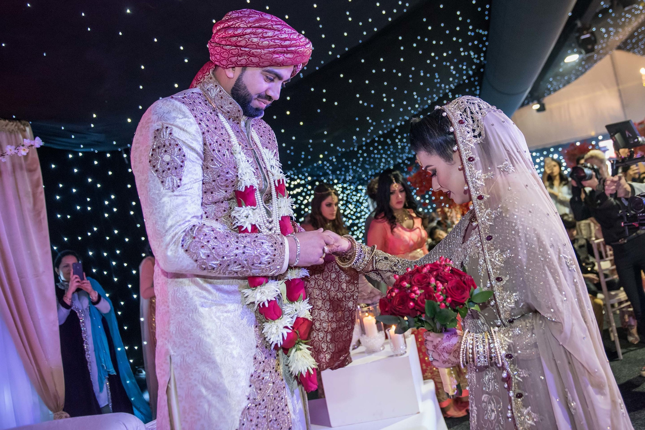 Wedding photographer Newland Manor,  Chalfont St Peter, UK Nikon D850 groom greet his bride on the stage