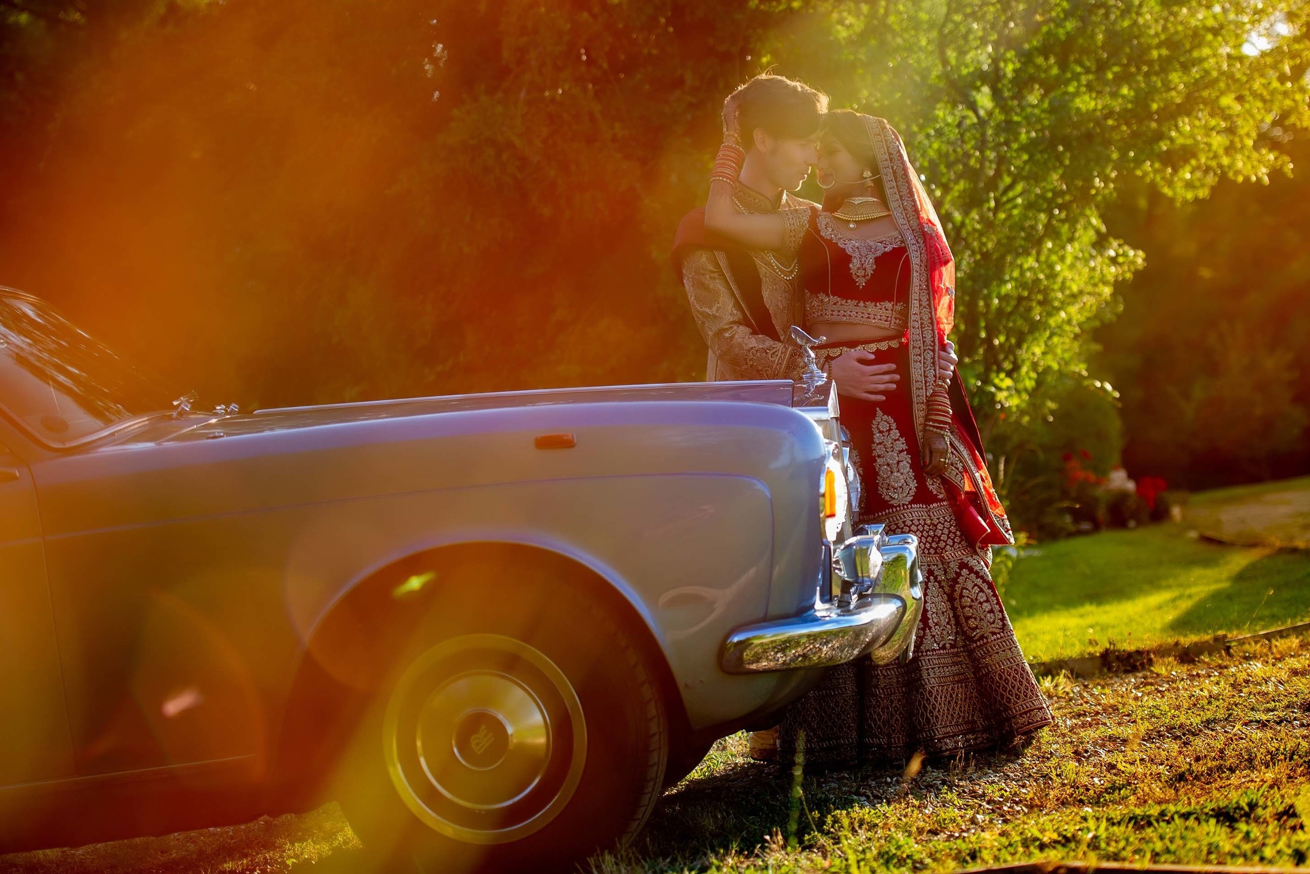 Wedding photography session Guildford, Surrey UK. Wedding photographer Nikon D850 couple posing near a  blue Rolls Royce car