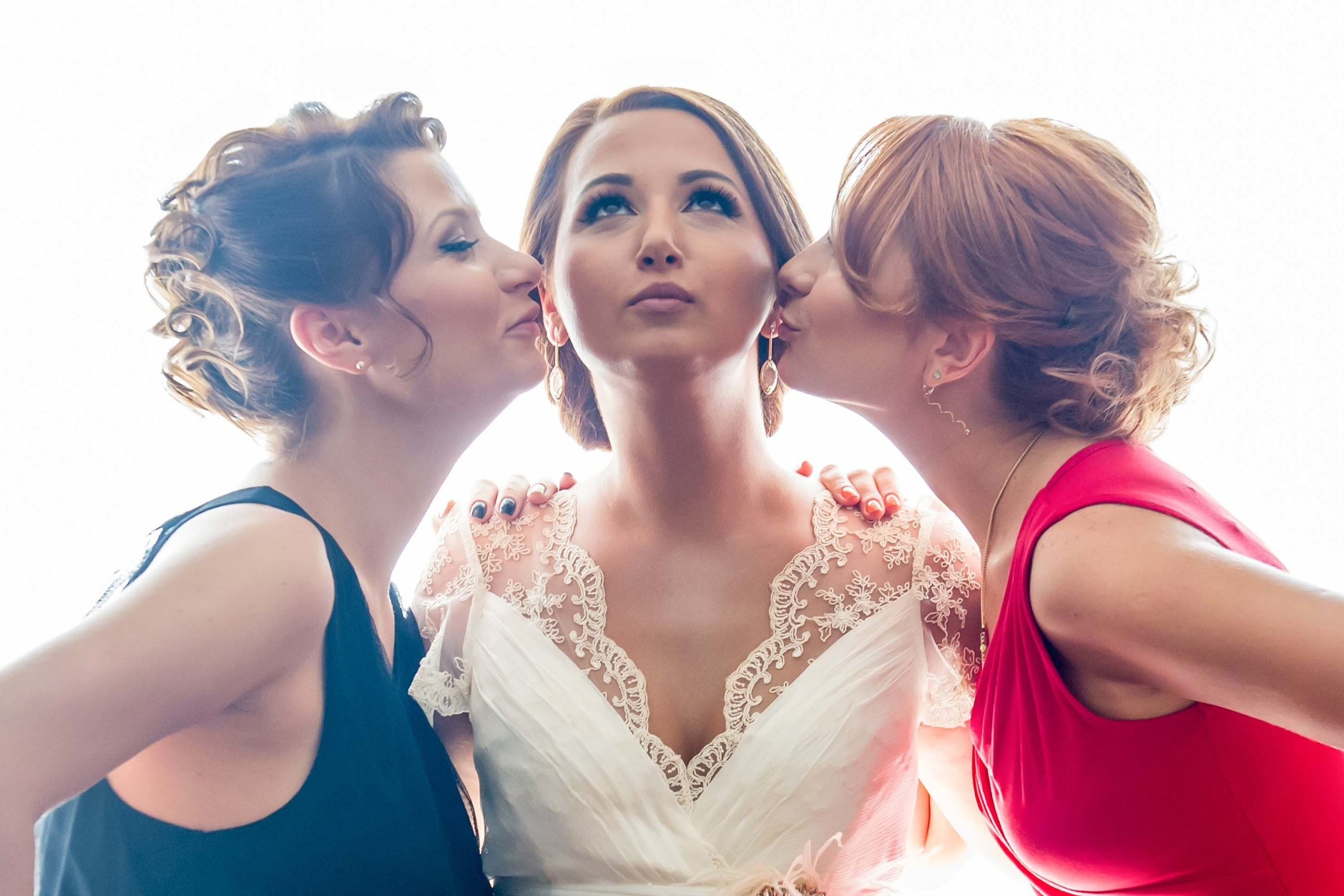 Wedding photographer Pullman Bucharest World Trade Center RomaniaNikon D850 bridesmaids kissing the bride