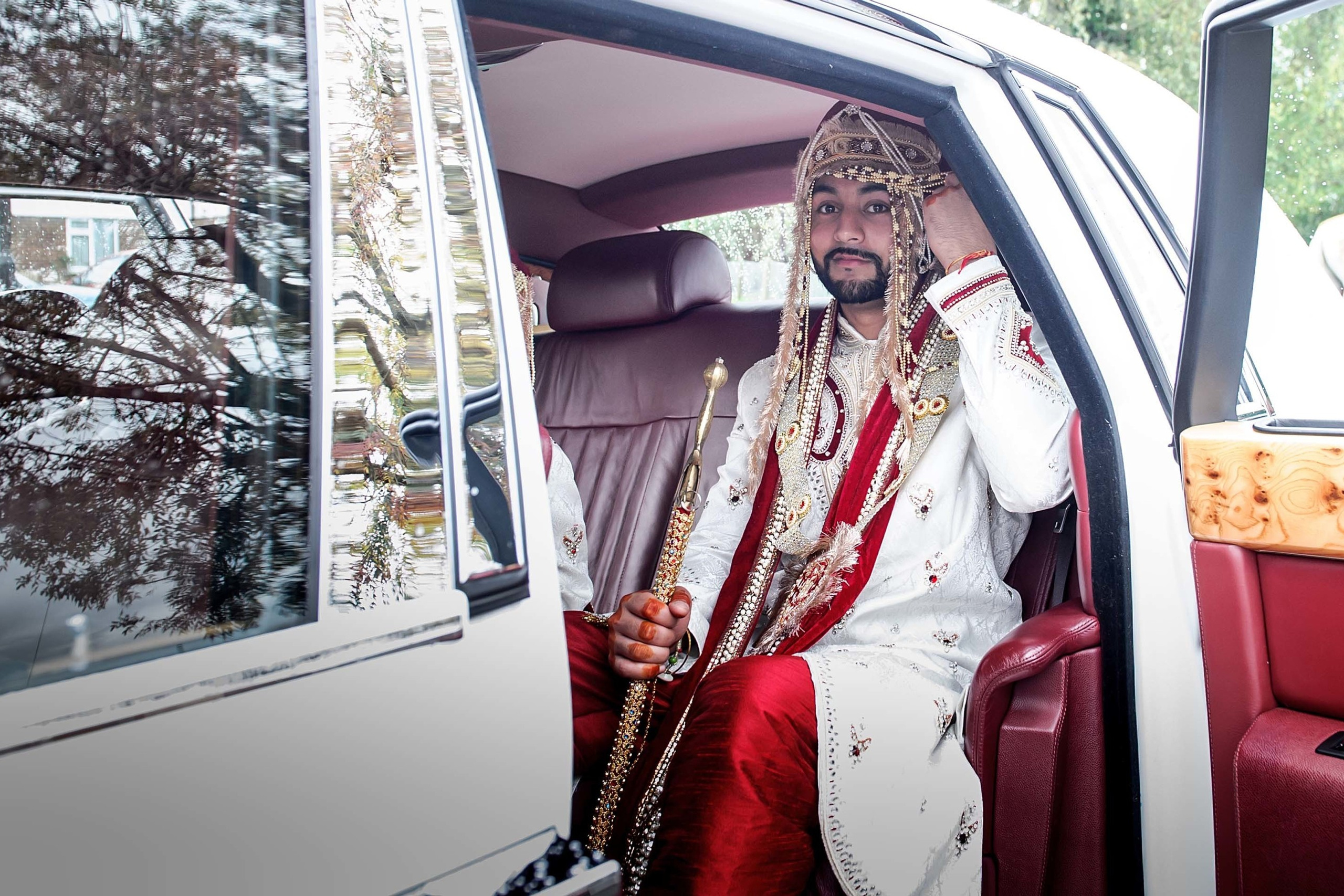 Wedding photographer Guru Nanak Darbar Gurdwara London UK Nikon D850 groom on his way to the temple in a Rolls Royce car