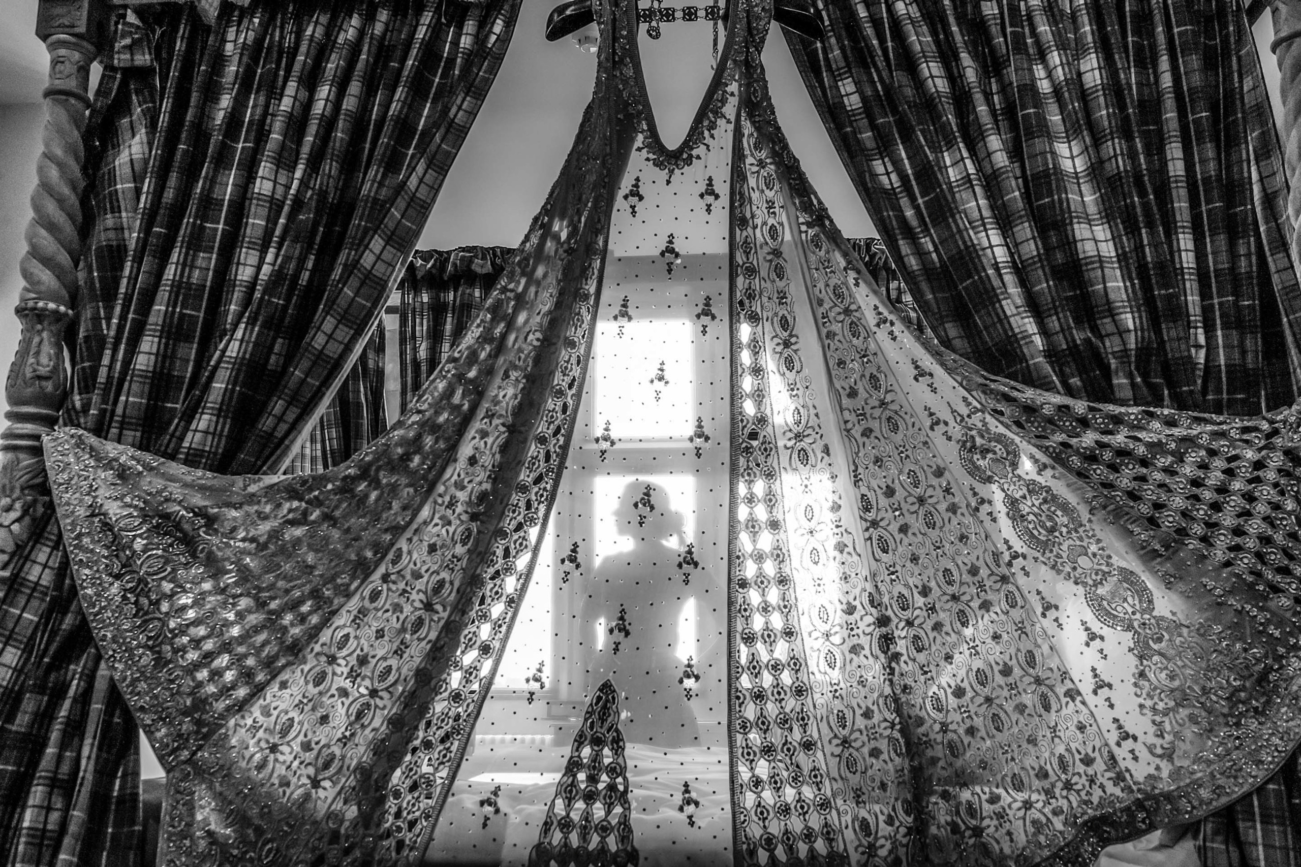 Wedding photographer Froyle Park, Hampshire UK asian bride silhouette seen through bridal dress Nikon D850