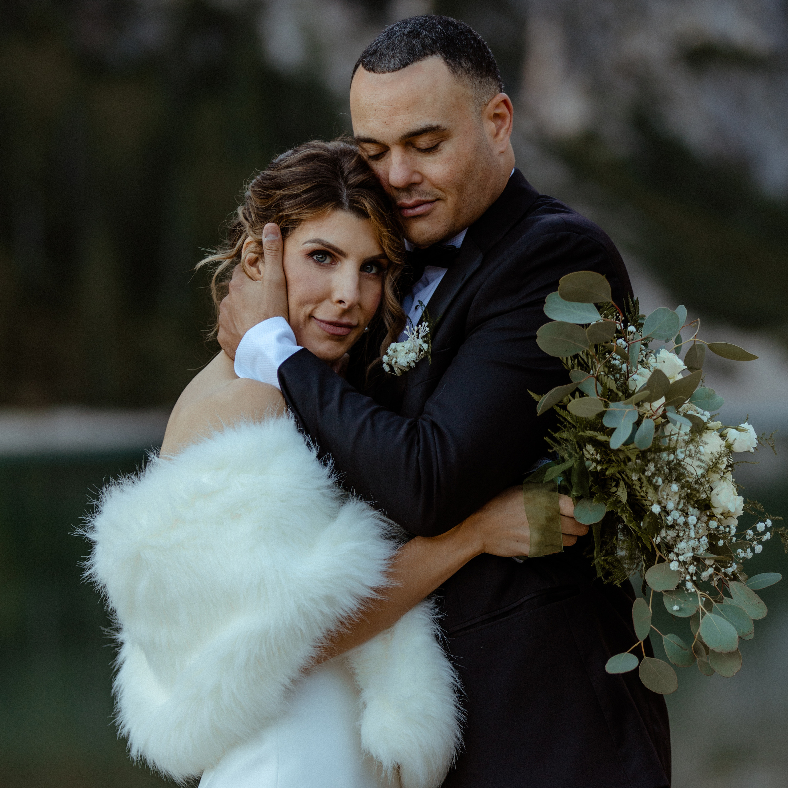 A couple in Iceland with a focus on their wedding bouquet 
