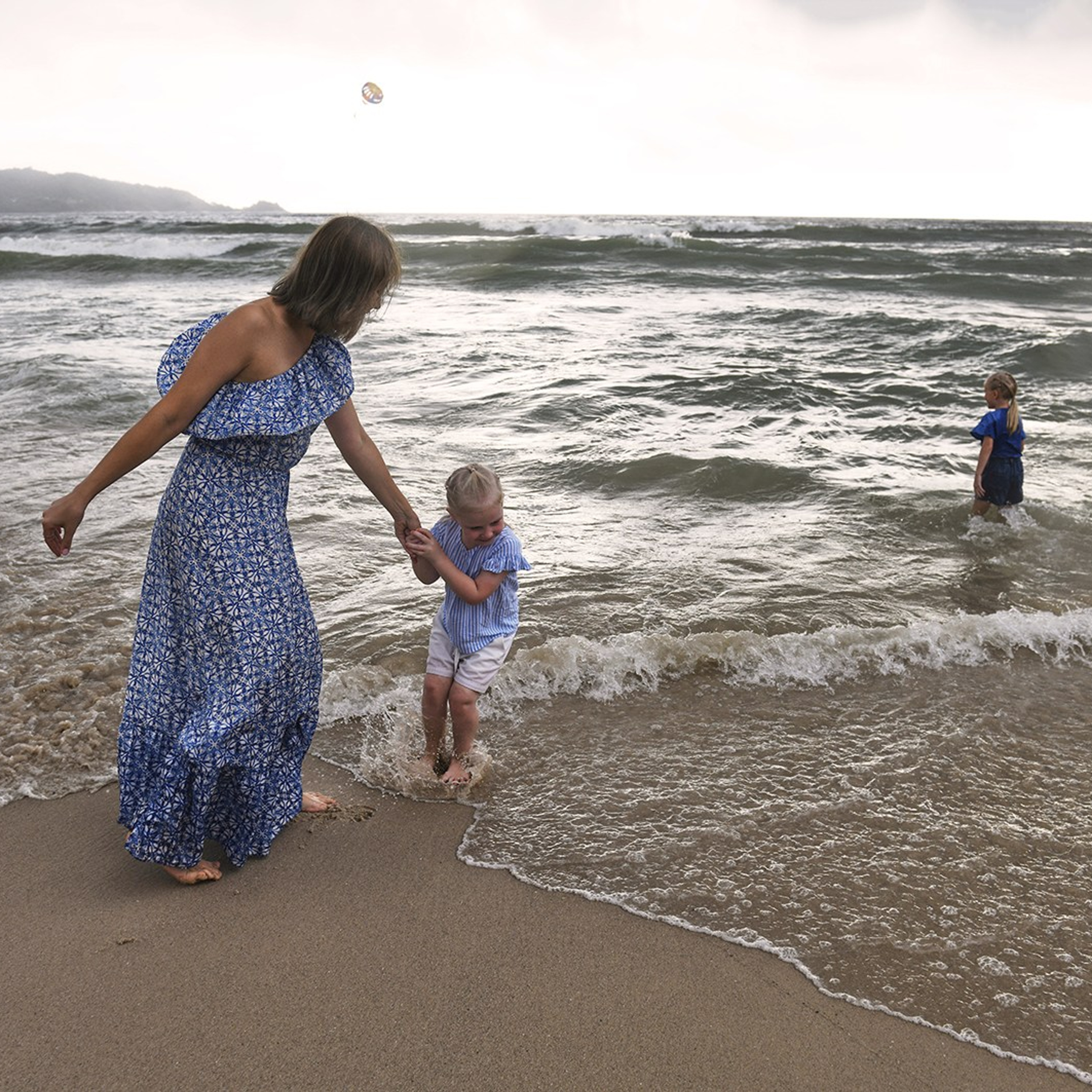 Lifestyle image of a family  by the sea