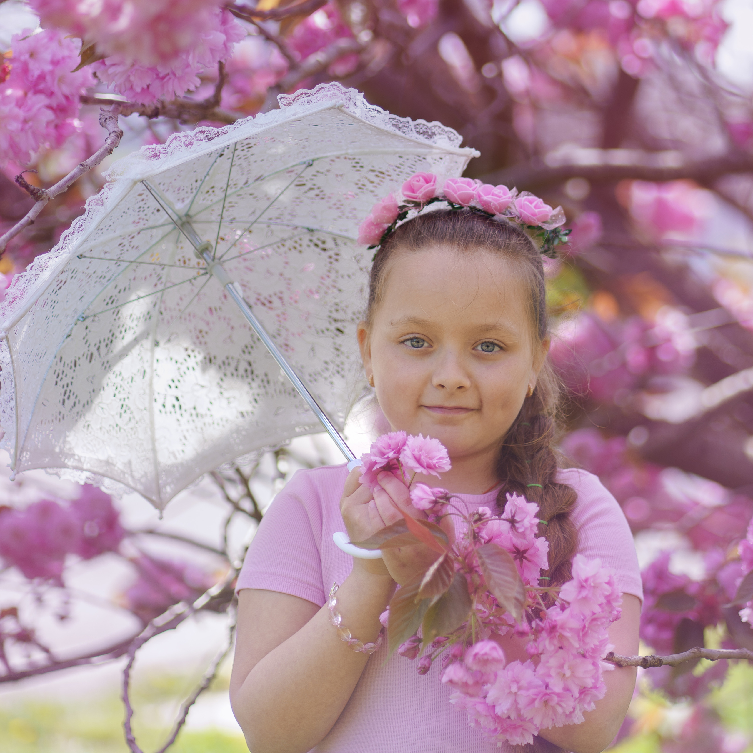 Little sisters in pink blossom
