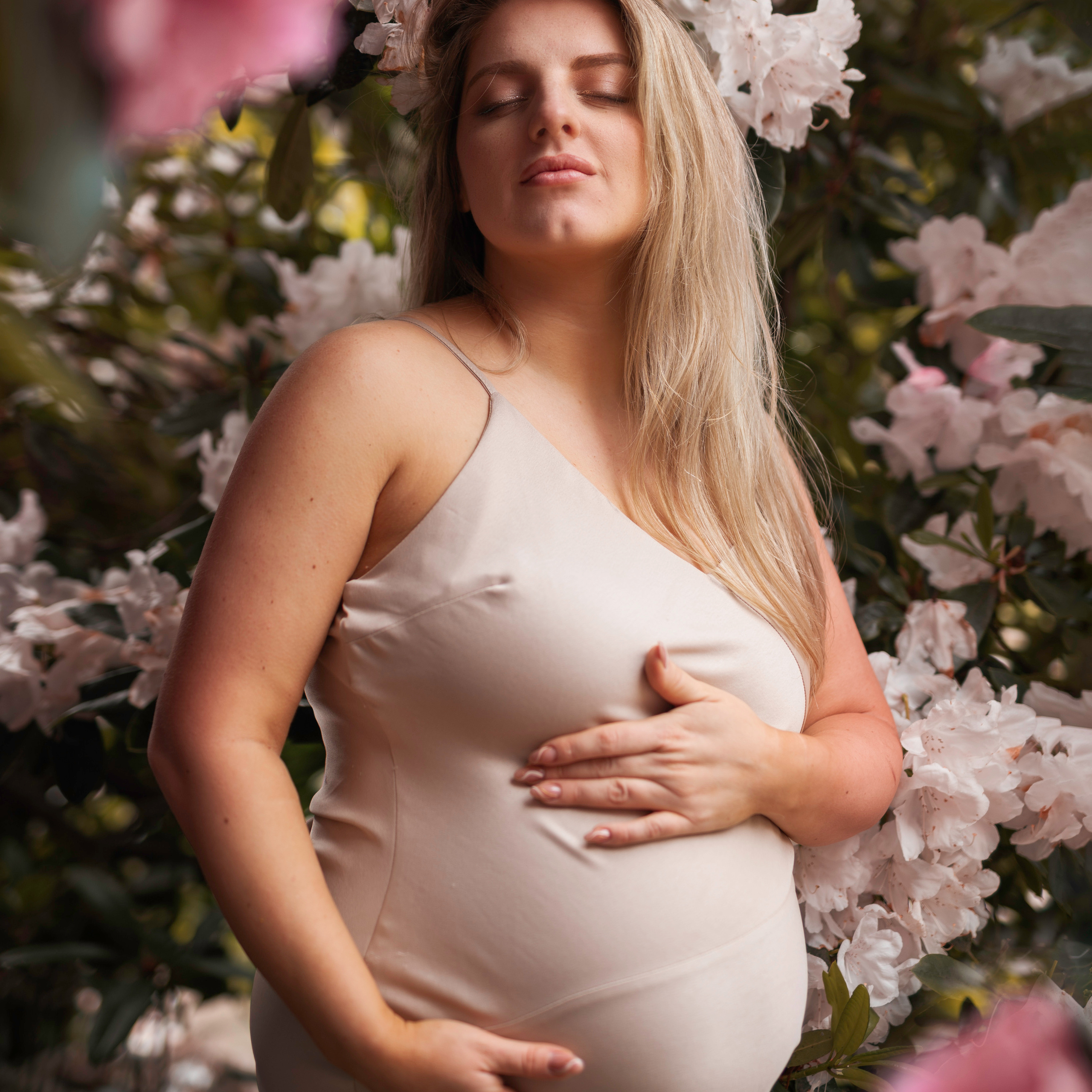 "A serene and beautiful pregnancy photoshoot set against the stunning backdrop of Yorkshire's Rhododendron fields."