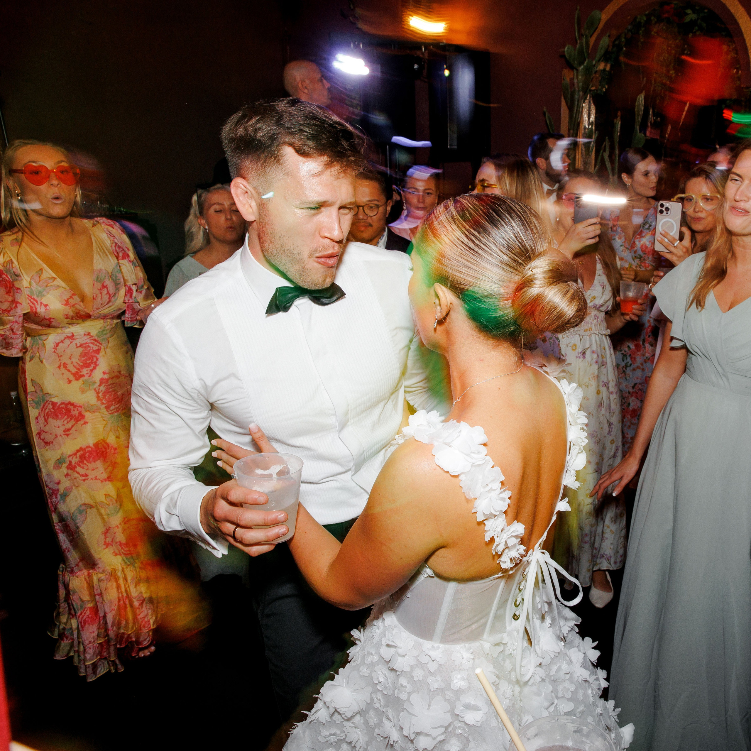 The groom and the bride dance in the club after the exciting wedding day