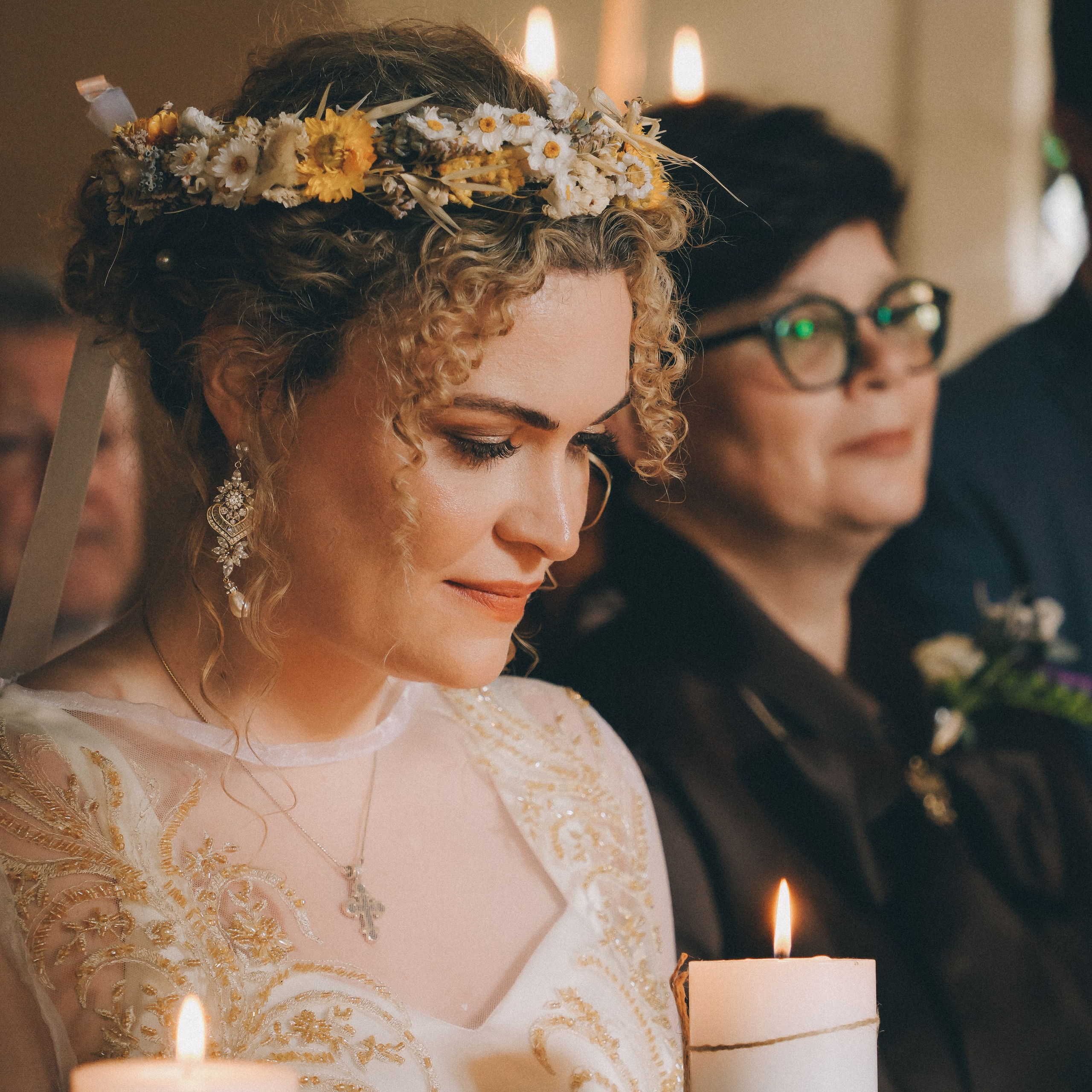 Wedding ceremony in solihull. Bride is holding a candle light.