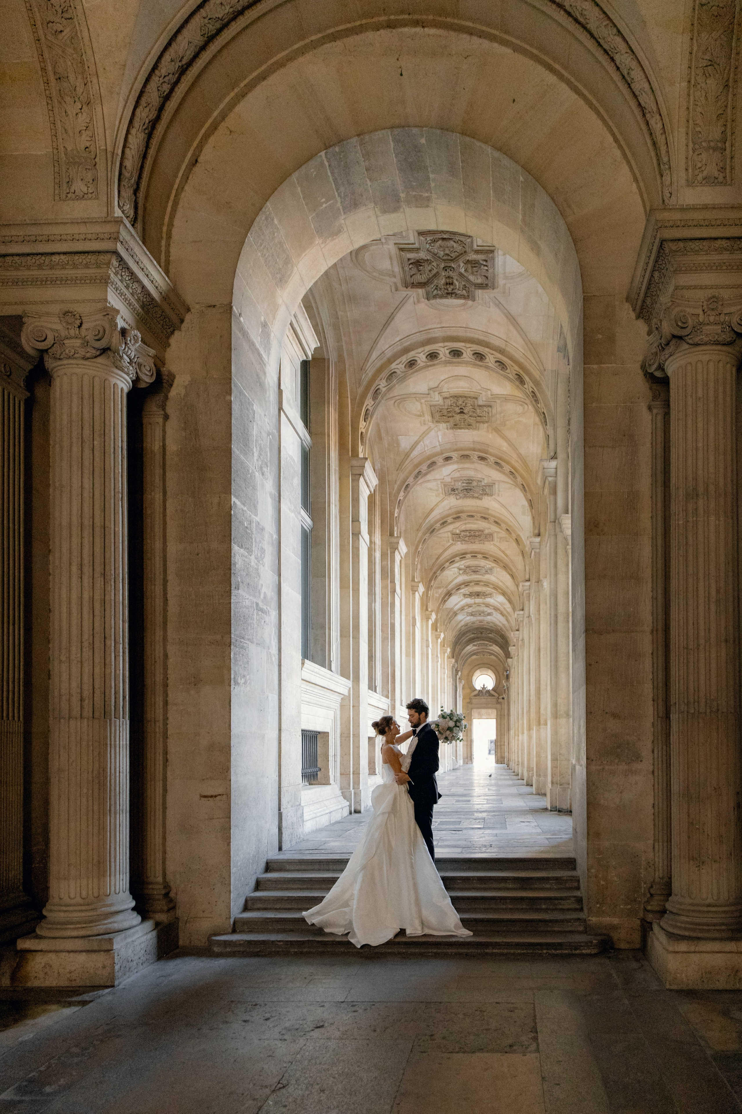 Elegant wedding portrait of bride and groom walking through the streets of ParisRomantic elopement moment captured in soft evening light in Paris, FranceLuxury wedding ceremony setup in a historic French venue with natural floralsCandid black and white photo of a couple at their city wedding in London, UKTimeless couple portrait in front of Marylebone Town Hall, LondonEditorial-style bridal preparation in a classic townhouse in the heart of LondonSoft light bridal portrait in a countryside château wedding in FranceFine art flat lay with French-inspired wedding details and vintage texturesCinematic golden hour photo at a UK estate wedding with historic architectureLuxury wedding tablescape with candles and florals at a London reception