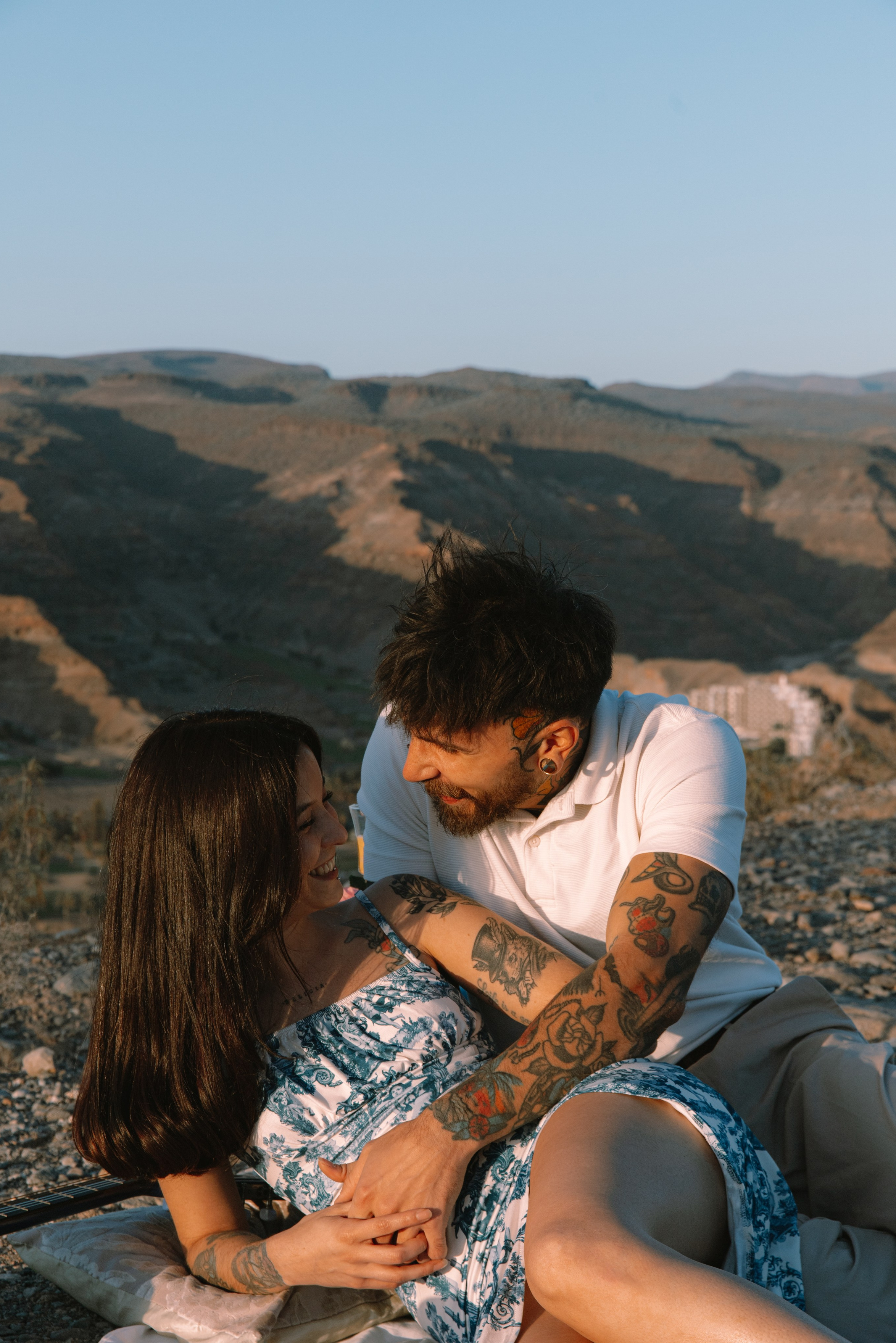 Couple on a picnic looking at each other