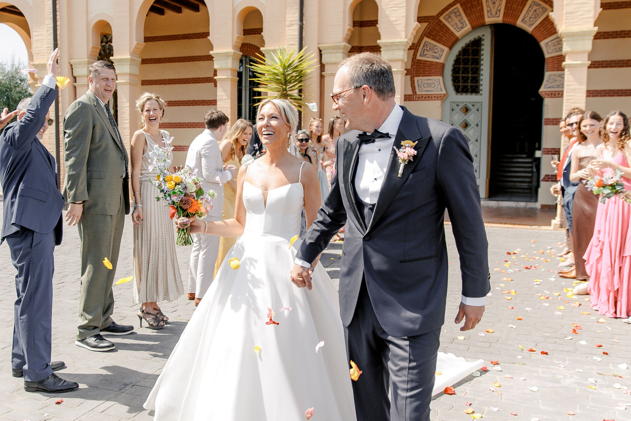 Groom and bride walking down the aisle after the wedding ceremony at Gran Villa Rosa
