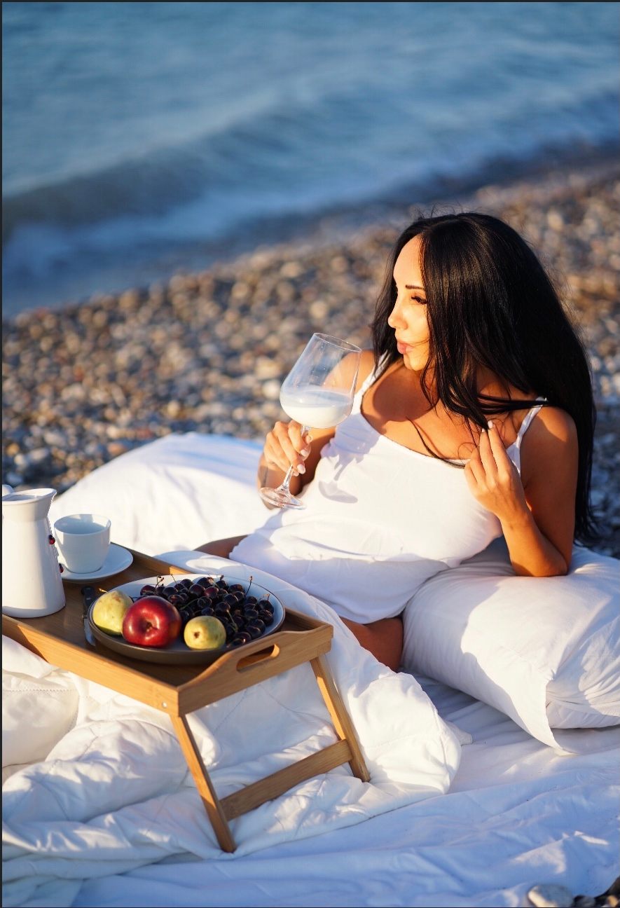 Sunset with beautiful Zenia. Photographer at Santorini