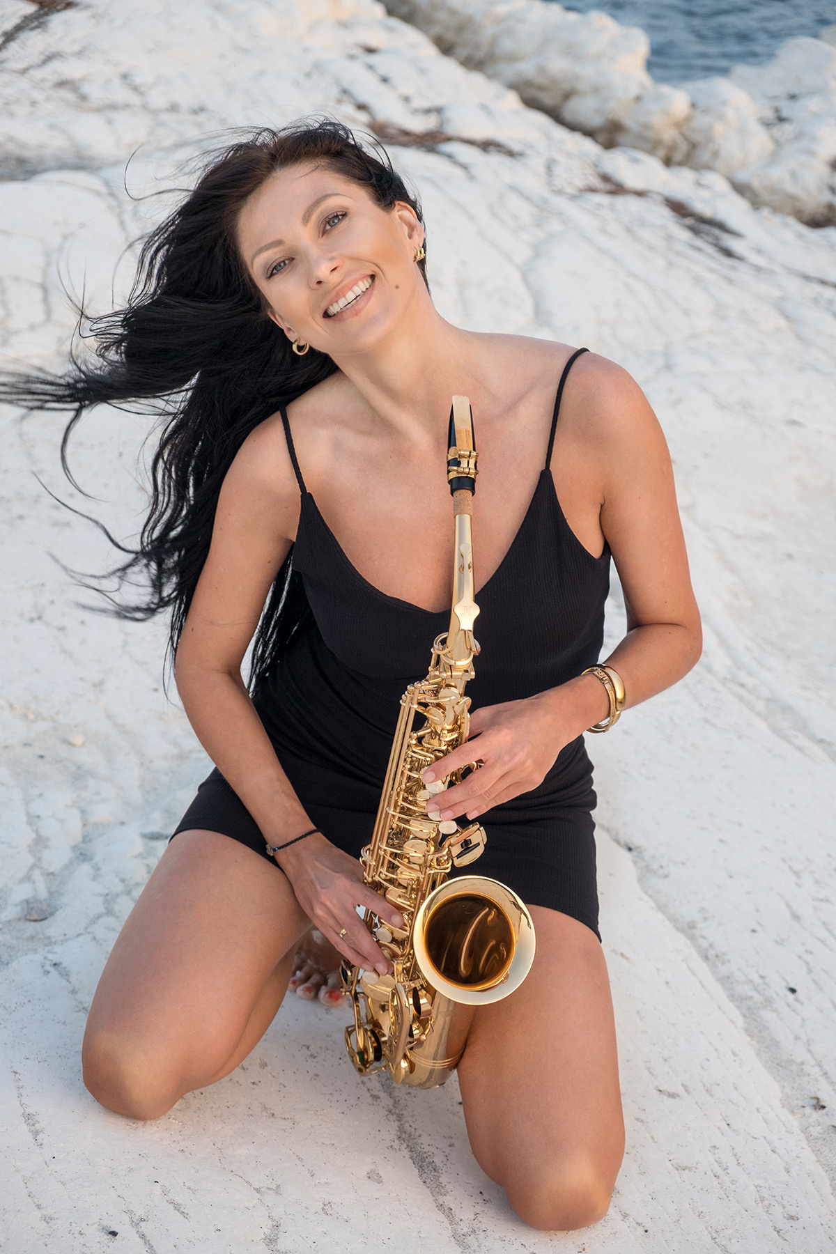 Lady in black dress with saxophone