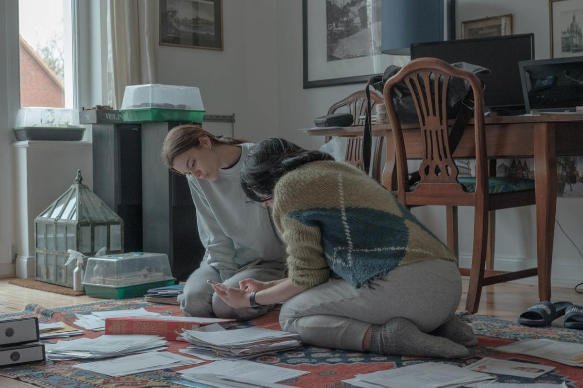 Svetlana and her daughter Natasha are helping to tidy up the papers in Max's working room, March, 2022