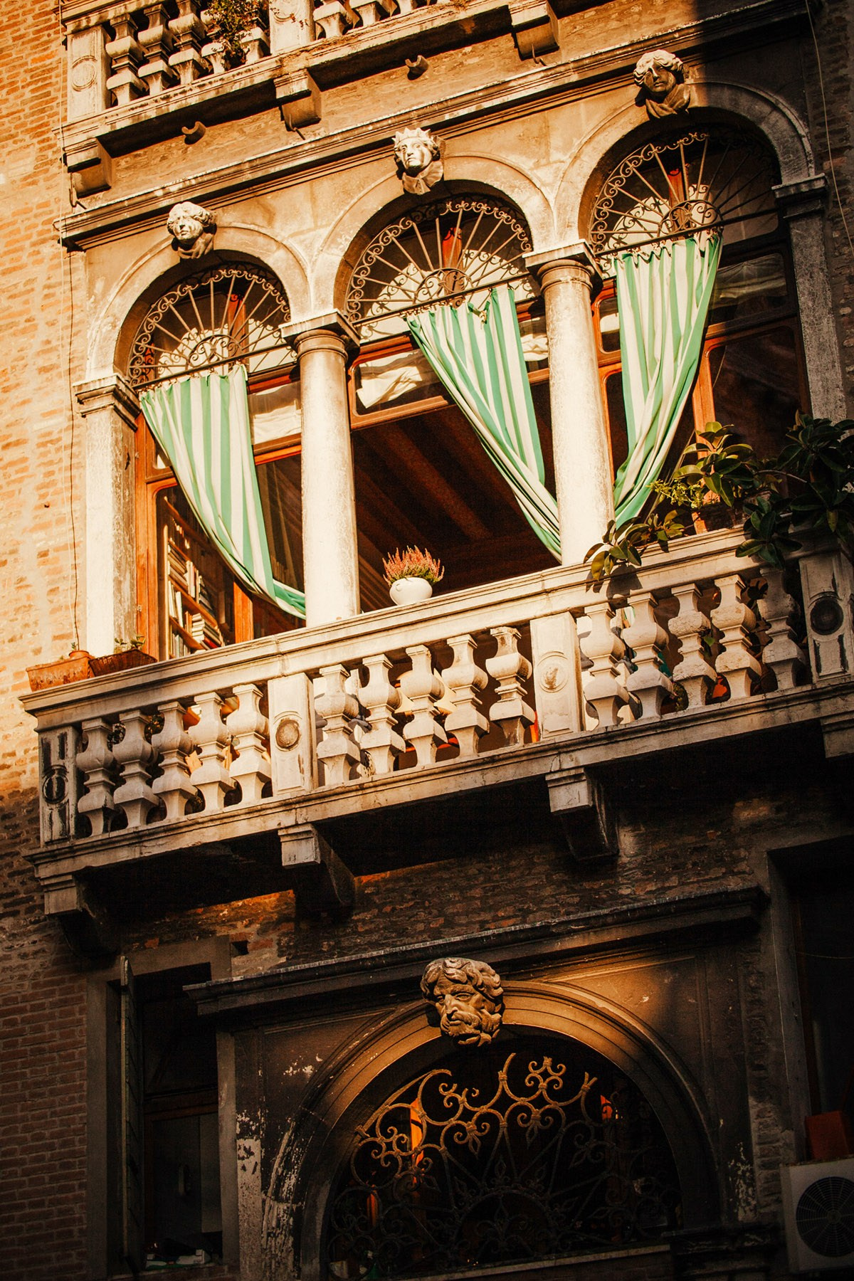 A home located along the canals of Venice is illuminated by the late afternoon sunlight.