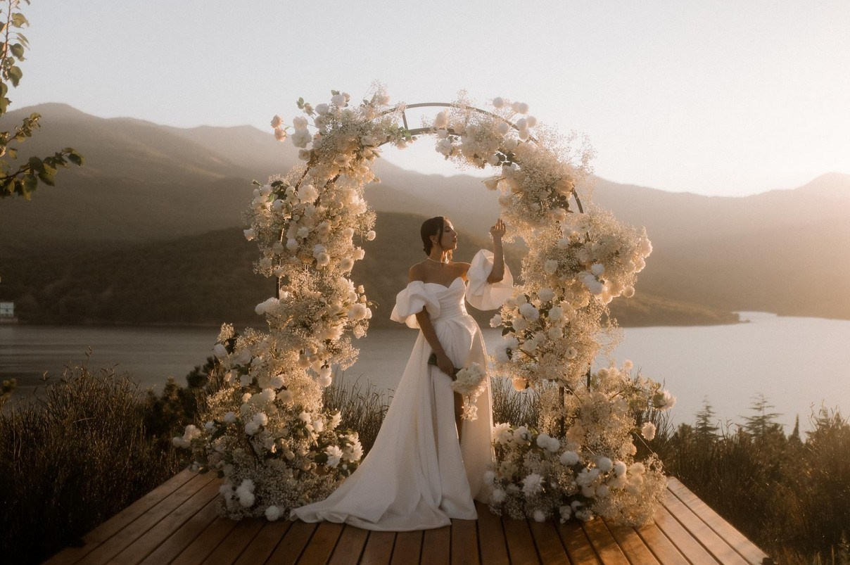 Romantic sunset portrait of couple in Santorini, Greece