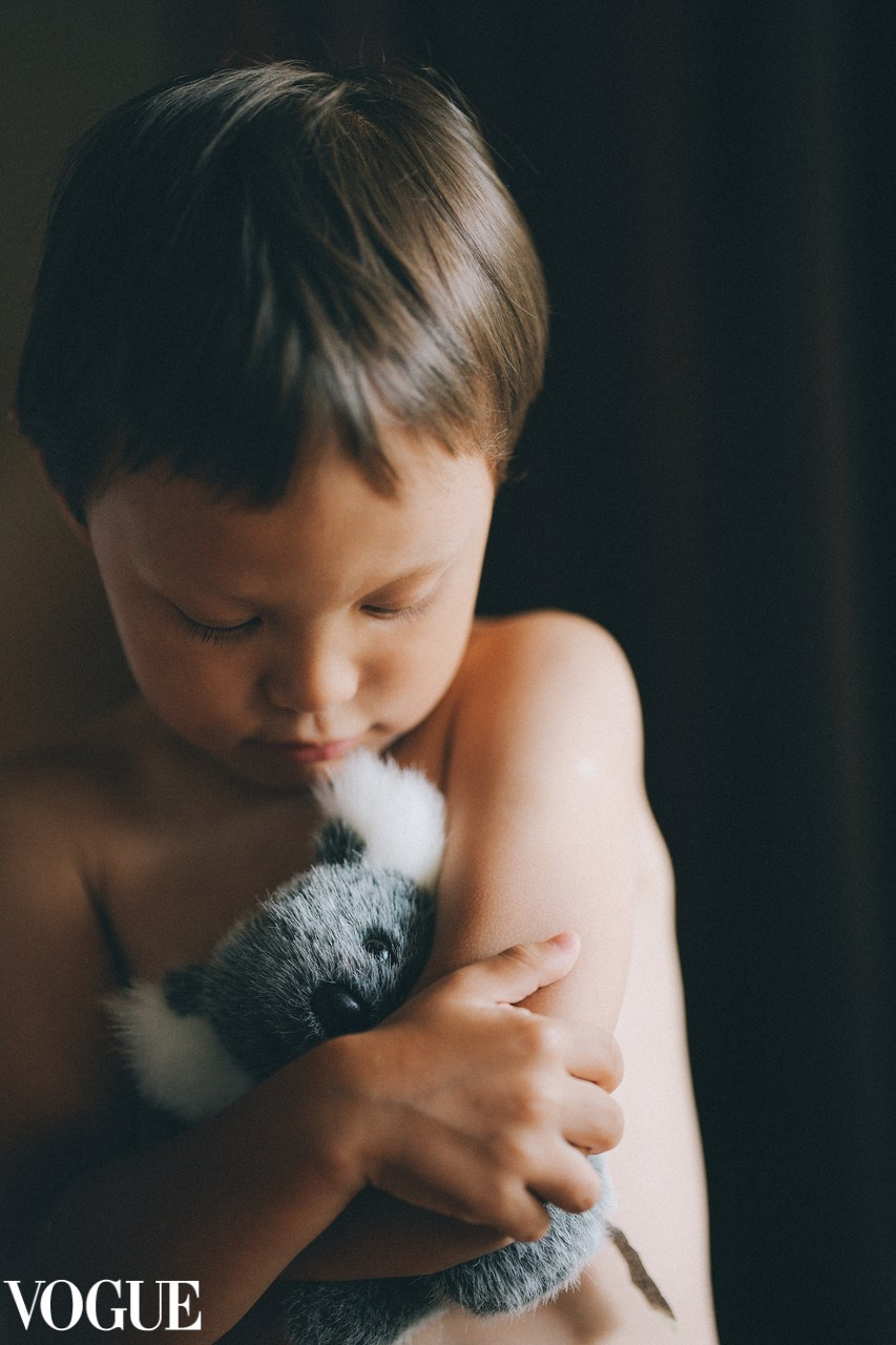 Boy is hugging a koala. Family photographer Solihull and Birmingham