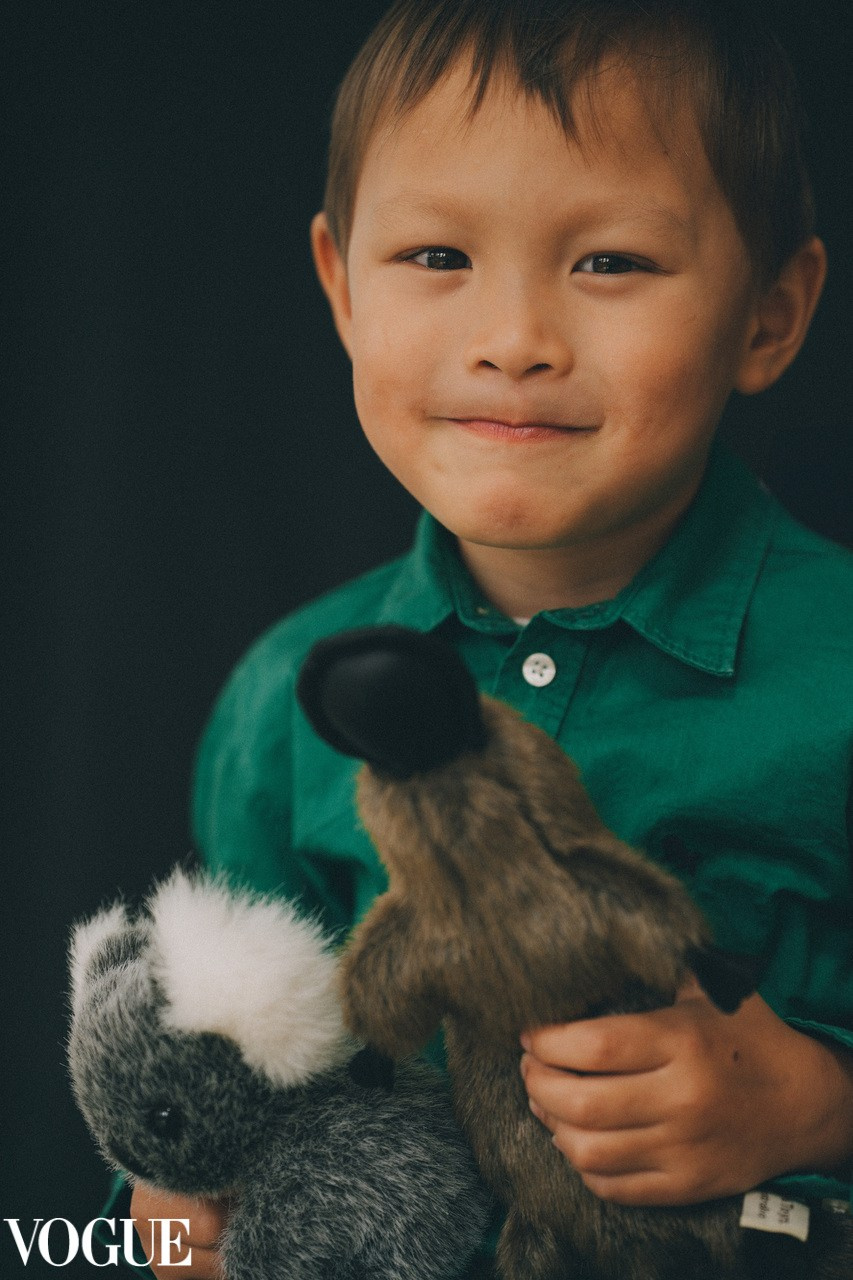 Kids photoshoot solihull. Studio portrait of the child with toys.