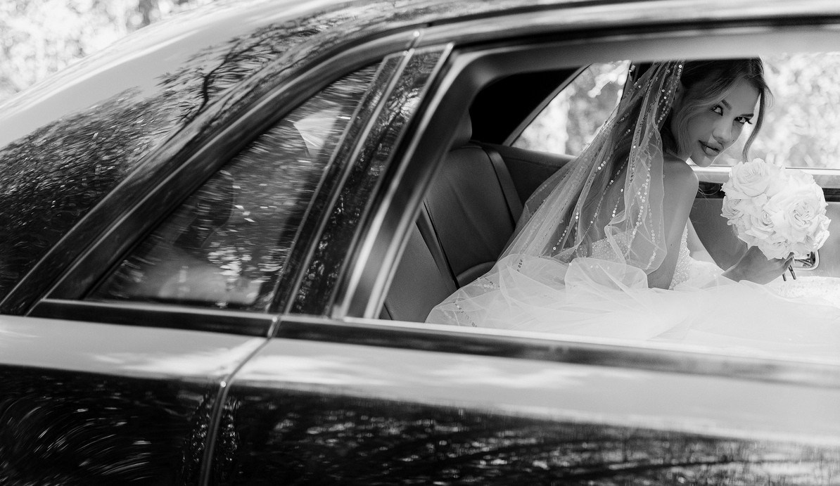 Bride looking over shoulder in chic editorial portrait