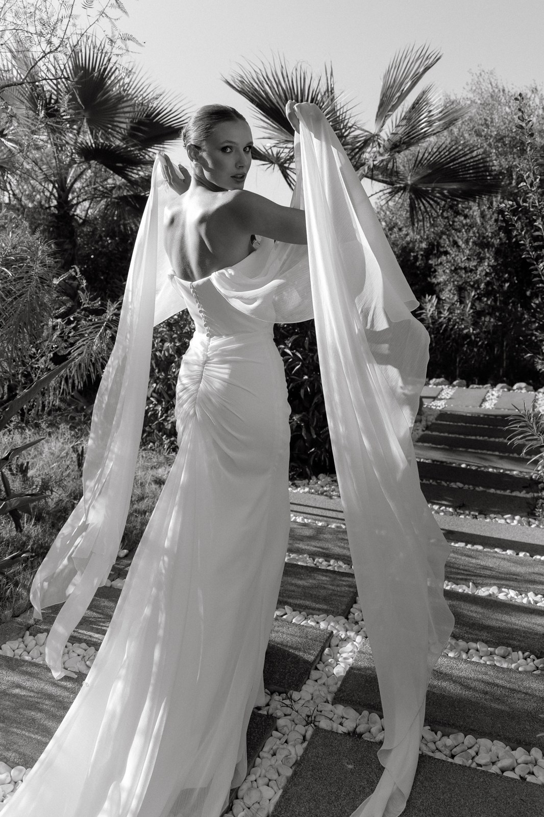 Editorial style photo of woman in elegant dress