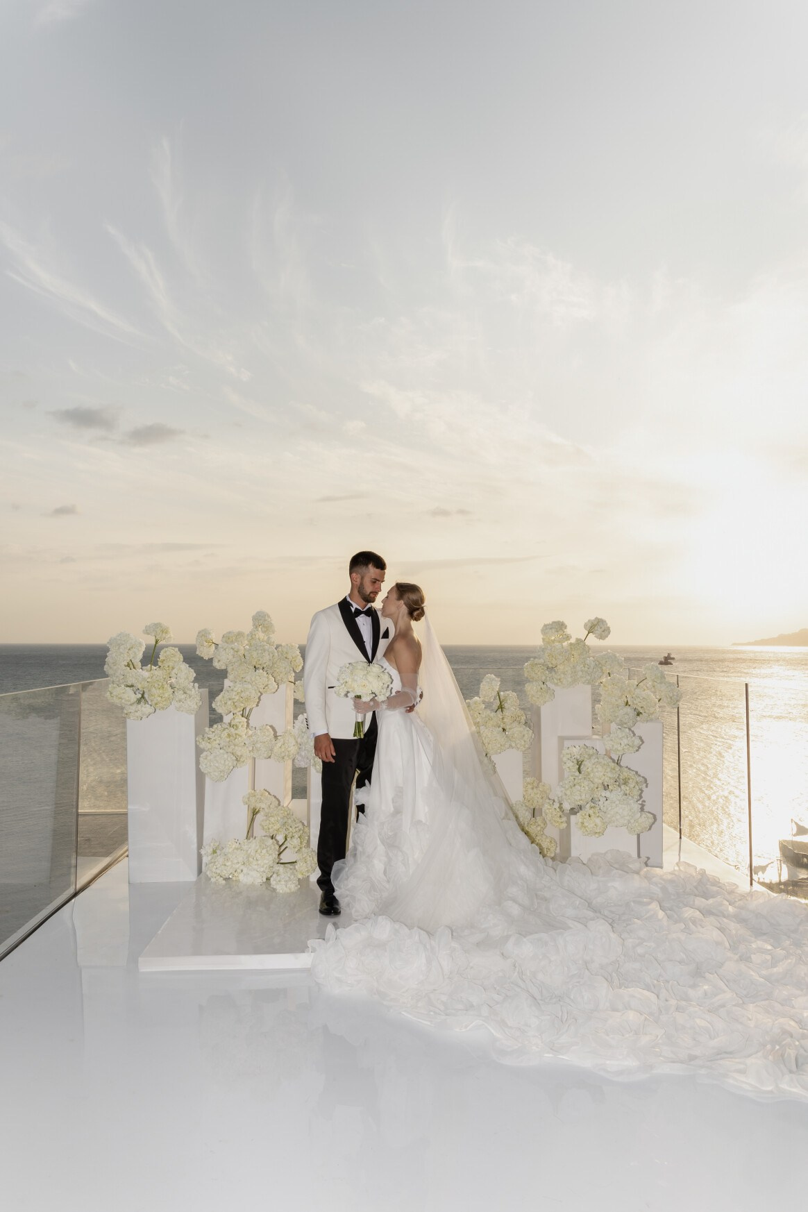 Modern editorial portrait of newlyweds at golden hour