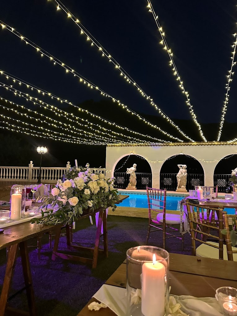 Wedding illumination with candles and lamps at night