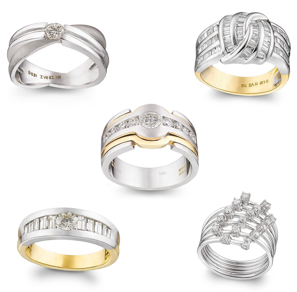 Pet zlatnih dijamantskih prstena na beloj pozadini.