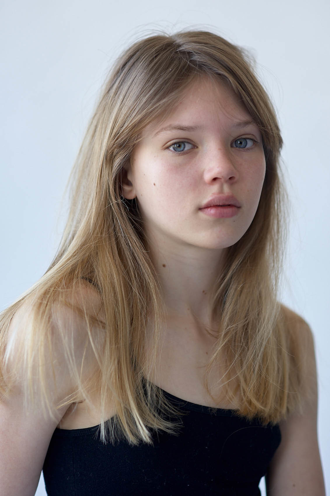 Young beautiful girl with long hair thinks she's a model, but she's a singer.