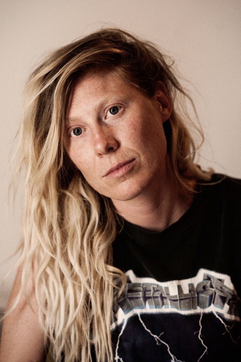 Yang woman with dreadlocks and wearing a Metallica T-shirt during a summer workshop in Marfa.