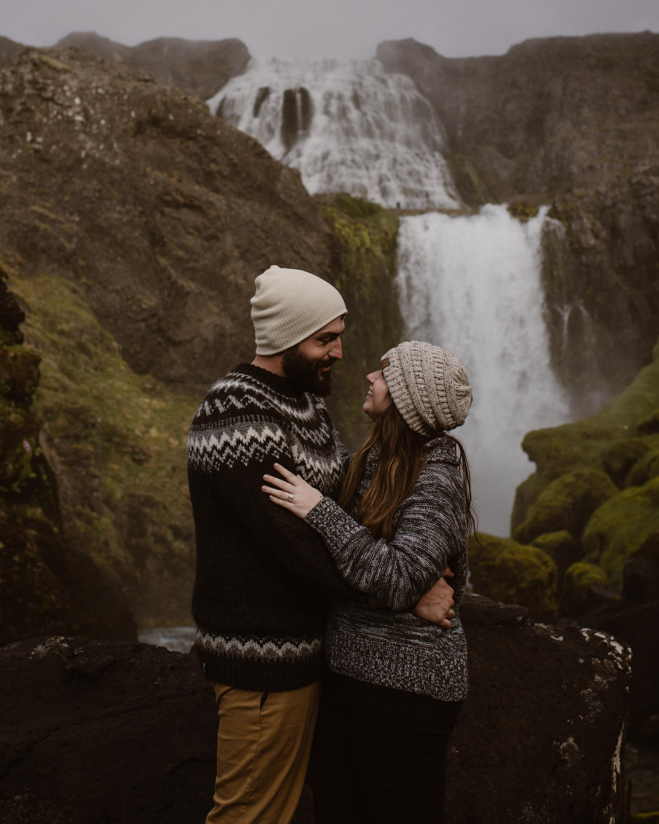 Silhouette of newlyweds against a glowing Icelandic sunset at Reynisfjara Beach