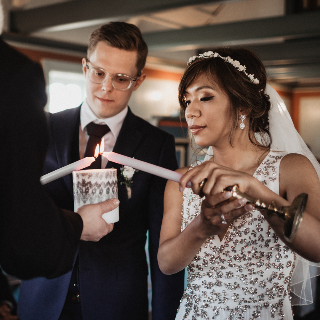 A couple with candles on their wedding day