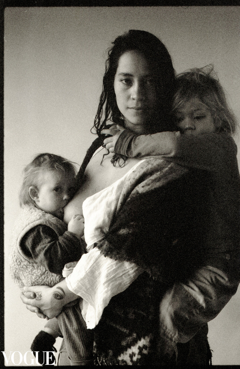 Portrait photography of a young woman surrounded by children immersed in the yurt life in Almere Netherlands