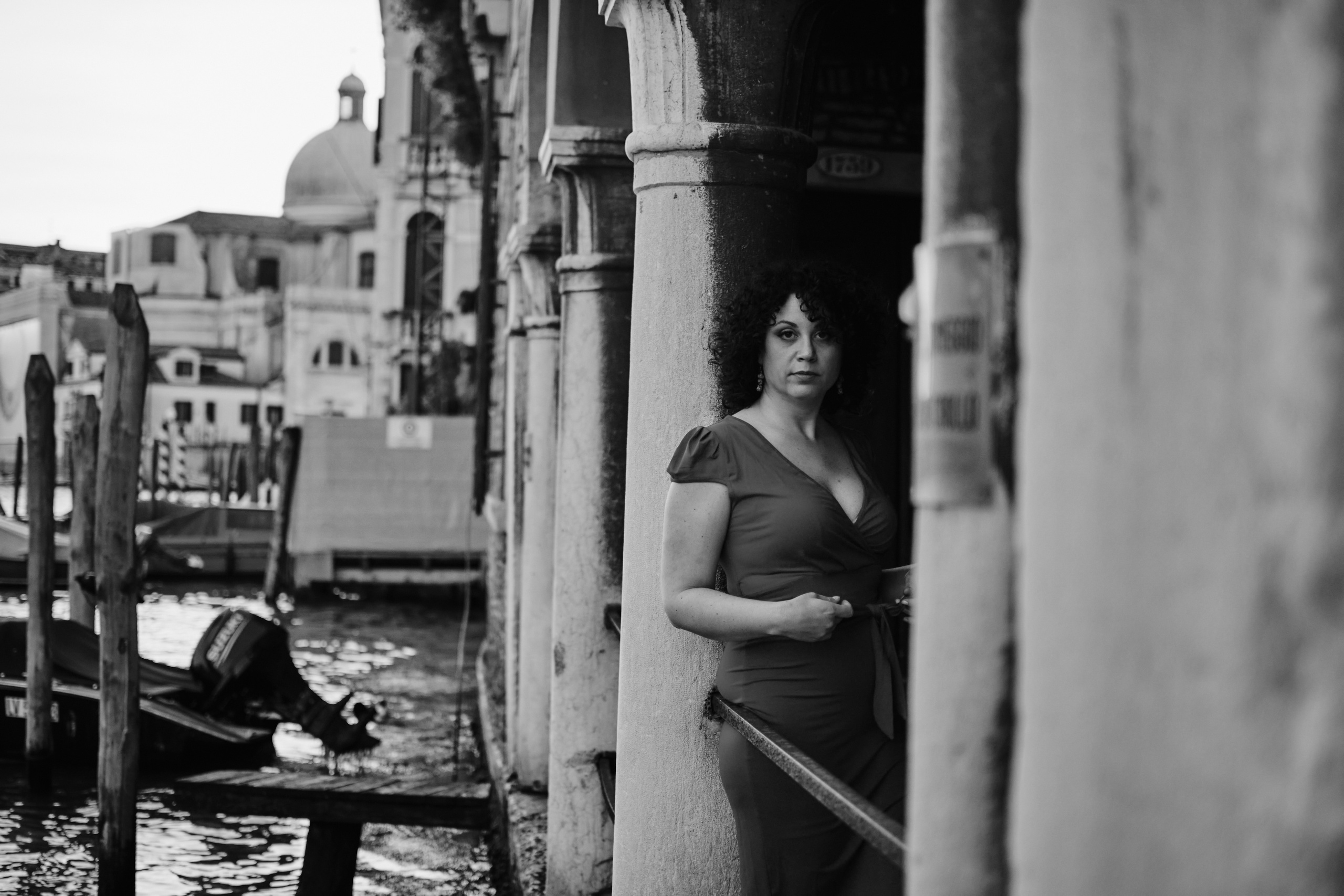 Atmospheric photoshoot in Venice with italian girl with red dress. Photographer in Venice, Italy. Yana Zotova