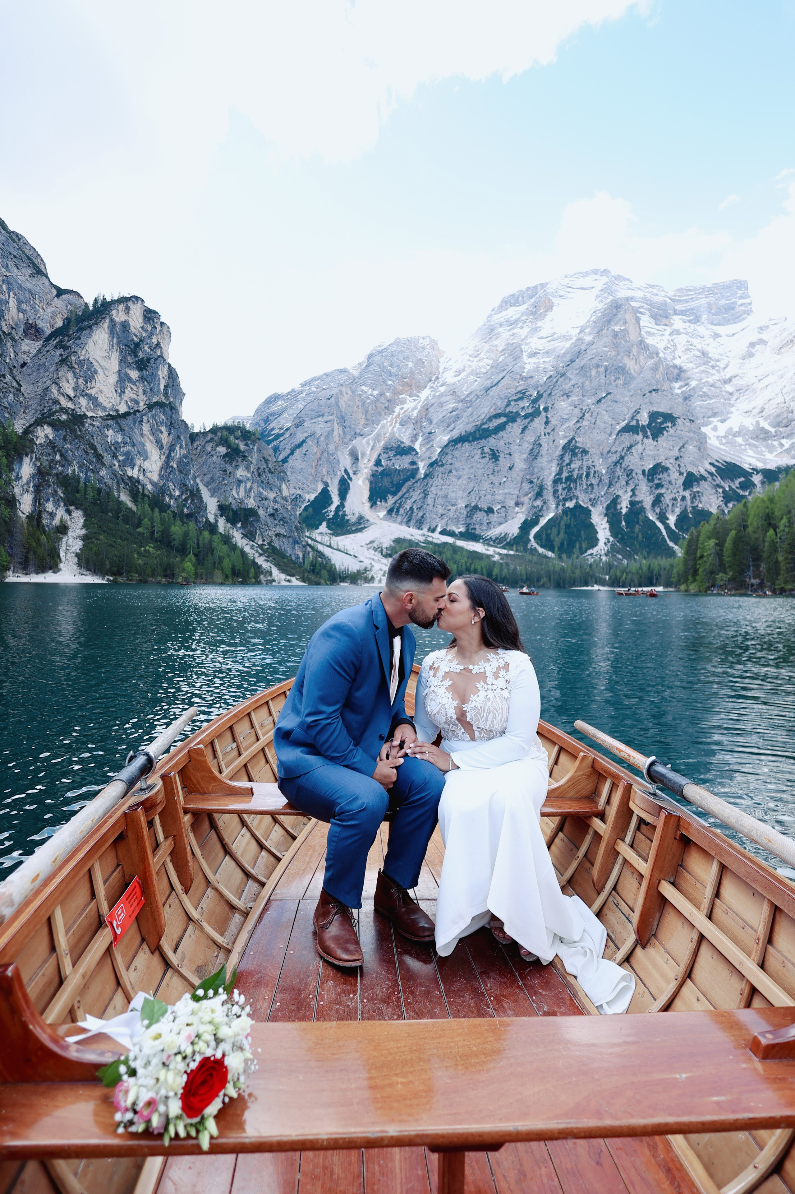 Wooden boat elopement ceremony in the middle of Lake Braies