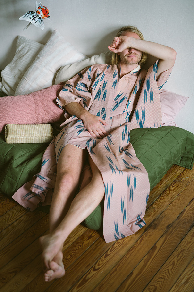 man in bath robe laying on the sofa as a preview for partner pictures