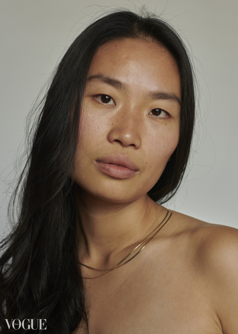 Portrait a young girl with long dark hair made in photo studio in Amsterdam