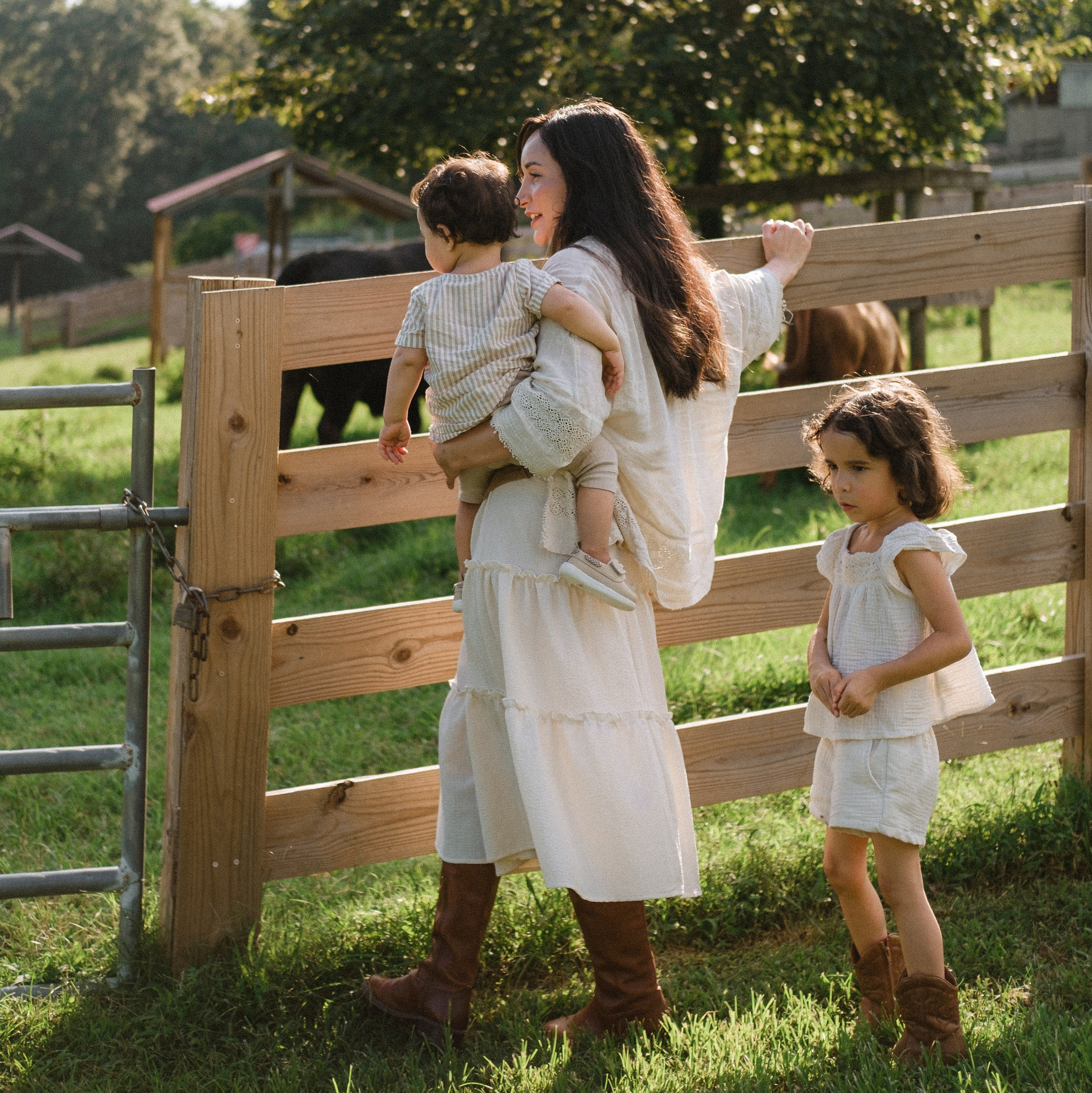A mother and her 2 babies during a family session at Maymont park in Richmond, VA