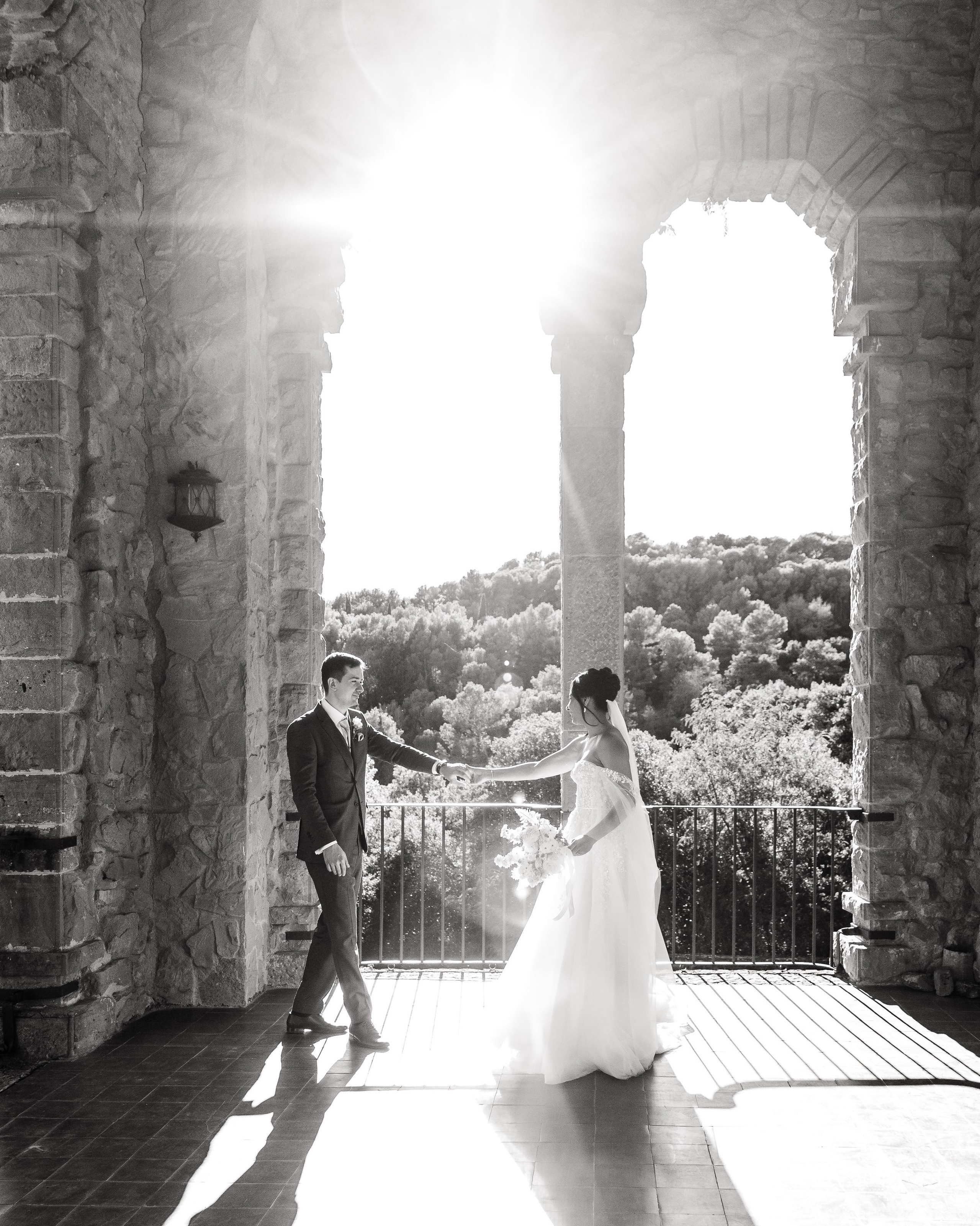 Groom and bride during their portrait session on the iconic balcony of La Baronia wedding venue