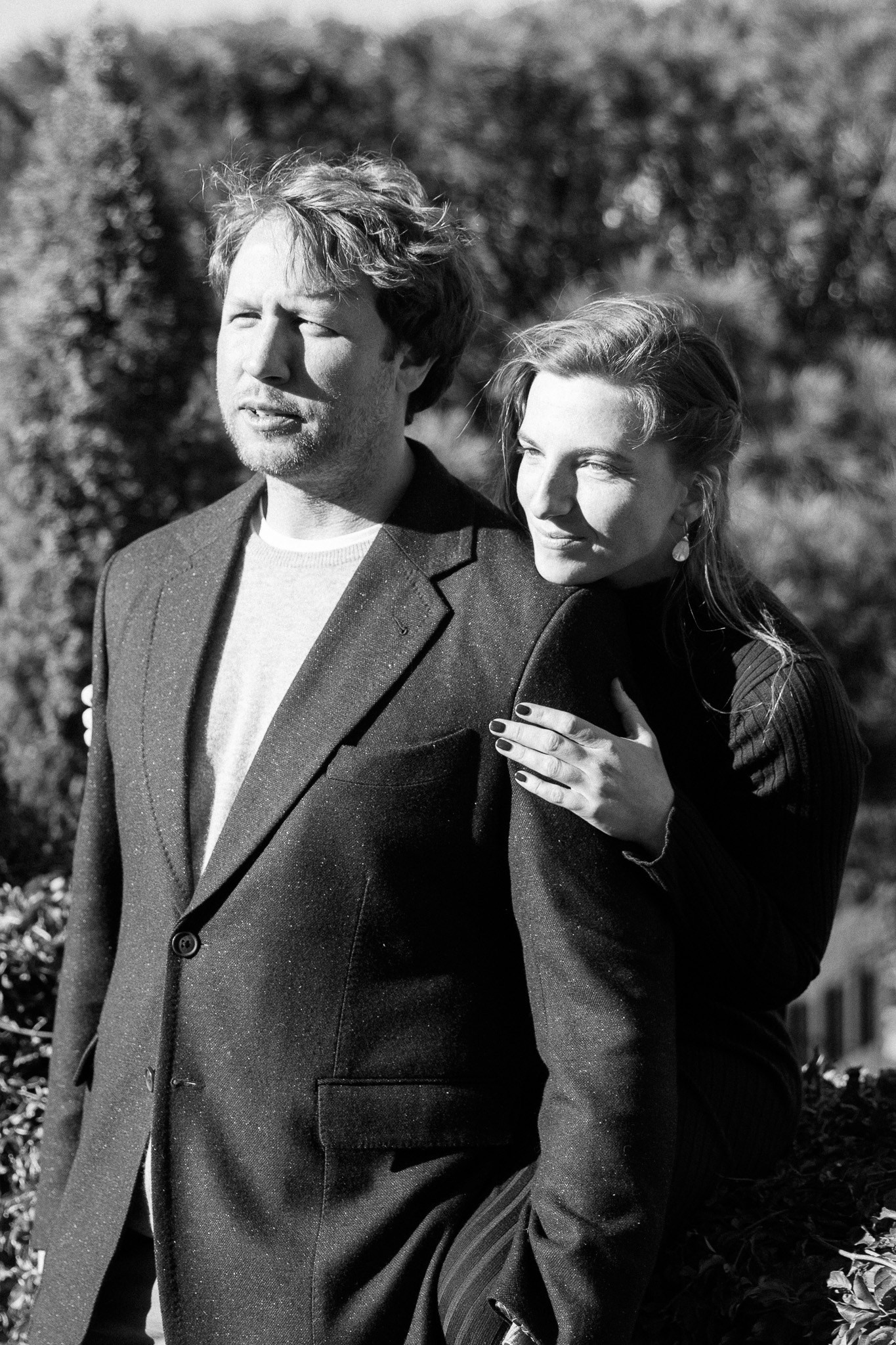 A couple in love sharing a quiet moment during their pre-wedding photoshoot in Rome.