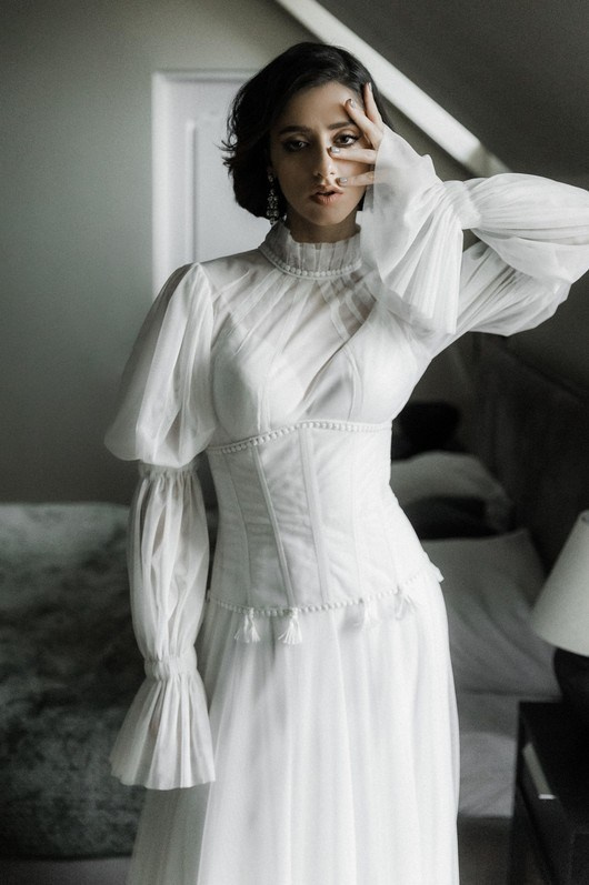 Intimate moment in luxury hotel bridal suite