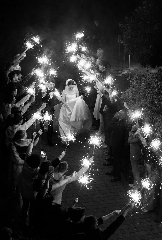 Wedding party enjoying sunset toast in Portugal